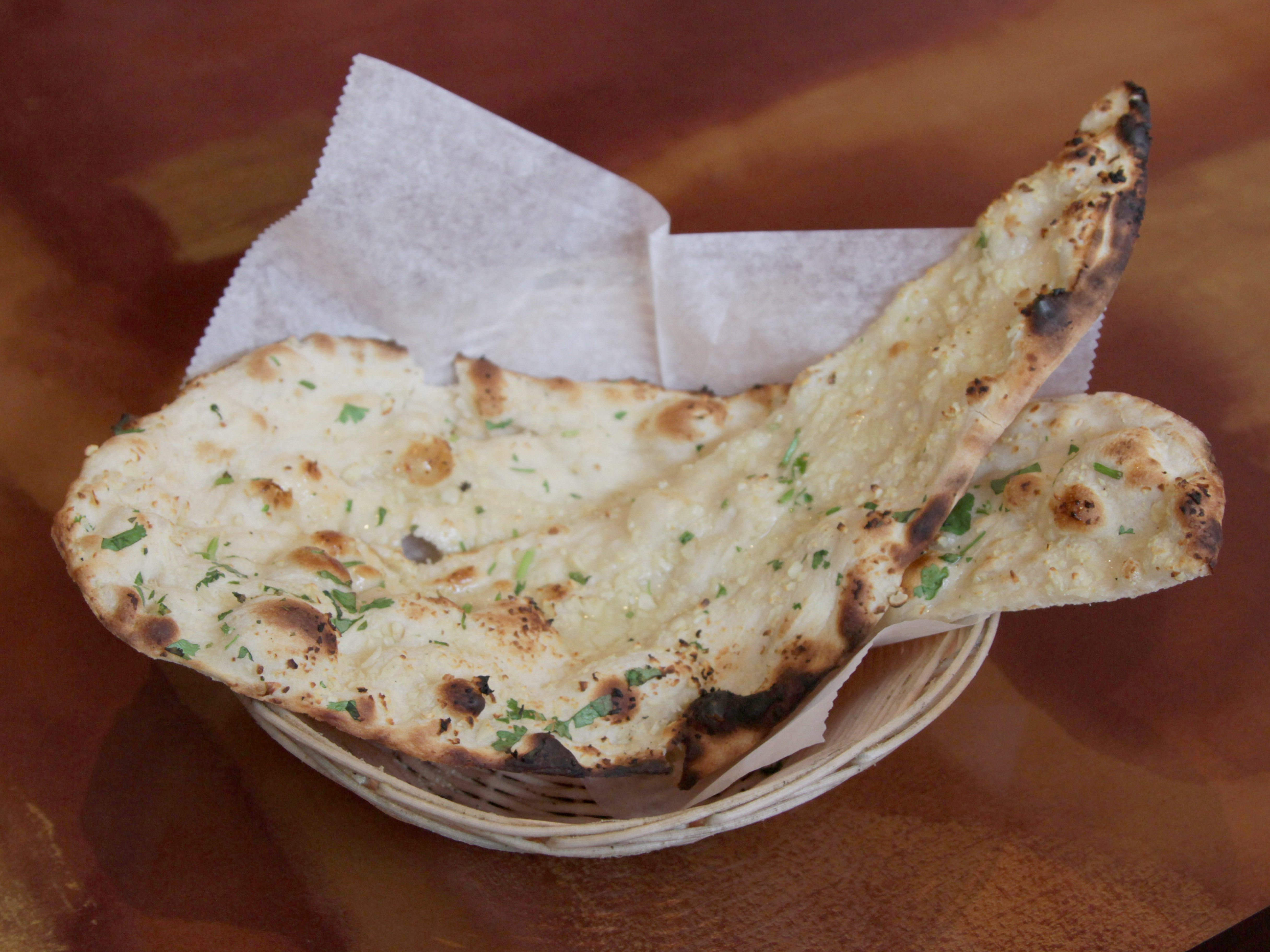 Order Garlic Naan food online from New store, South Richmond Hill on bringmethat.com