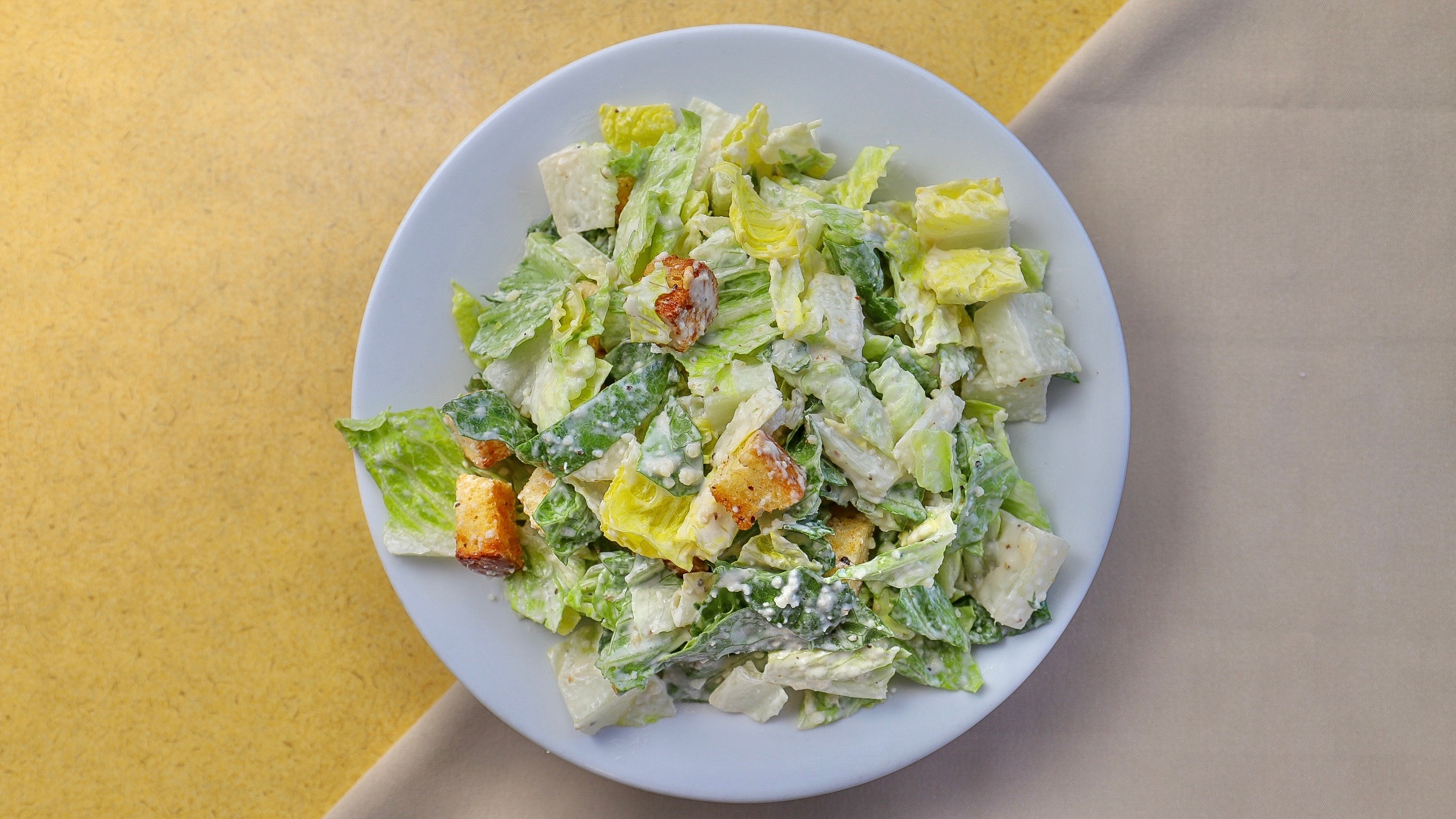 Order Caesar Salad food online from Toto's Pizzeria & Restaurant store, Belmont on bringmethat.com