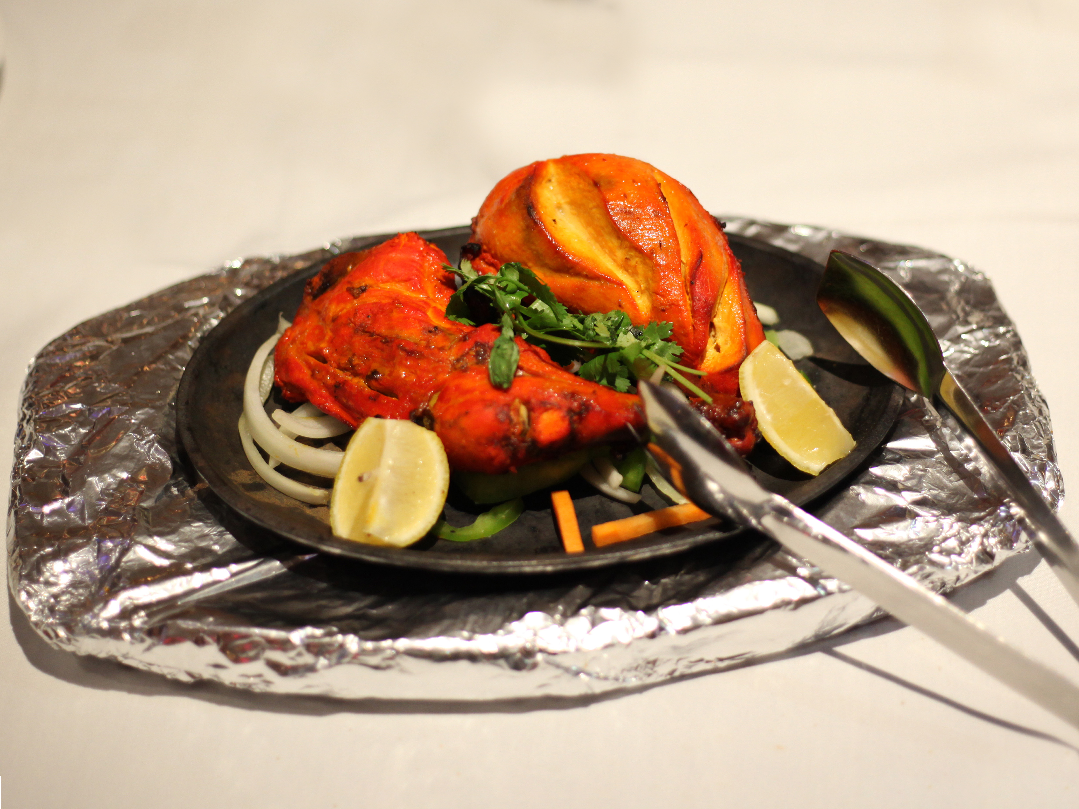 Order Tandoori Chicken food online from Little India Cafe store, Glen Burnie on bringmethat.com