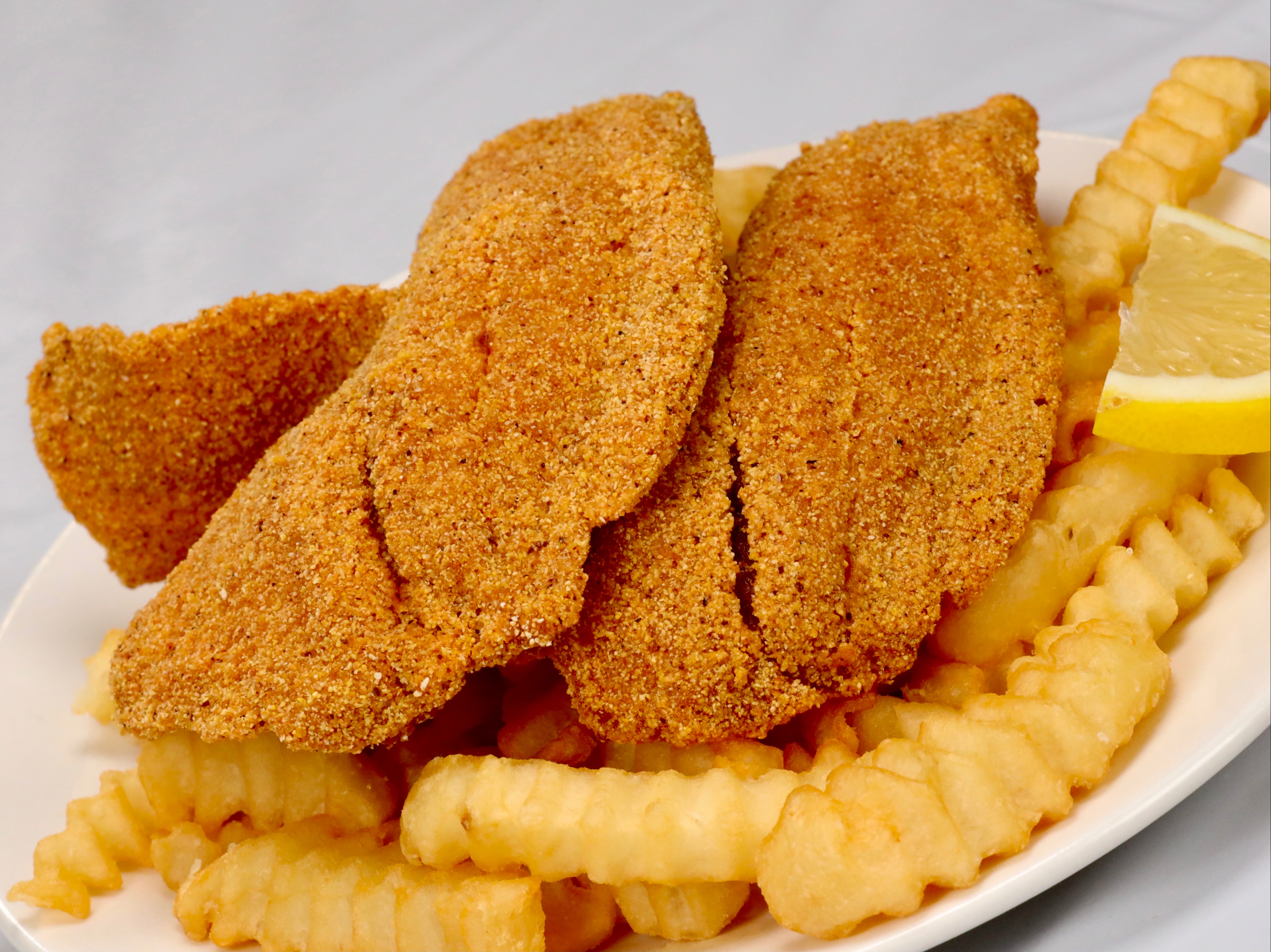 Order 2 PC Tilapia And Fries food online from Sam Sylks Chicken & Fish store, Cleveland on bringmethat.com