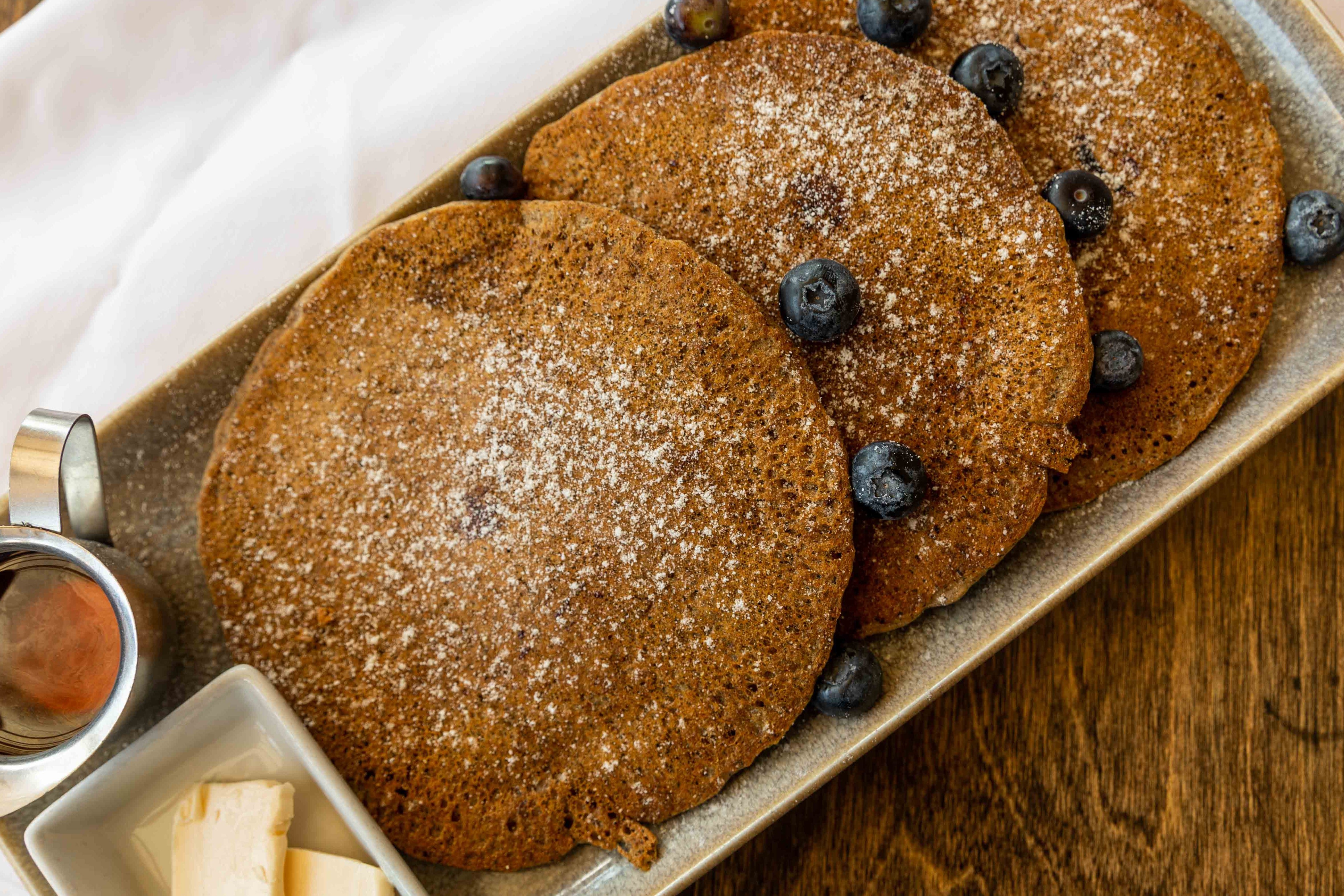 Order Blueberry Multigrain Pancakes food online from Cube Marketplace & Cafe store, Los Angeles on bringmethat.com