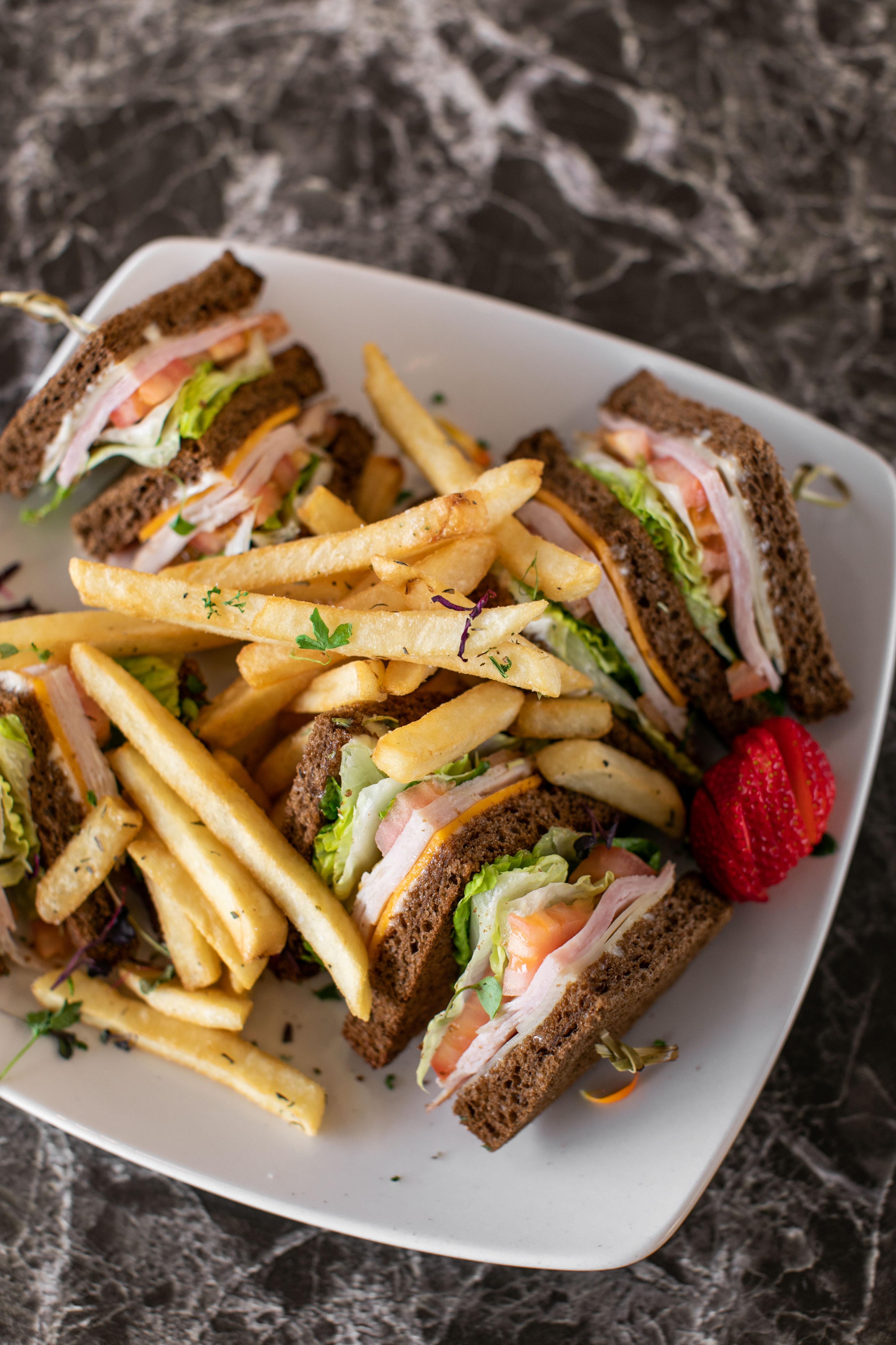 Order Club Sandwich w/fries food online from Rendez Vous store, Corona Del Mar on bringmethat.com