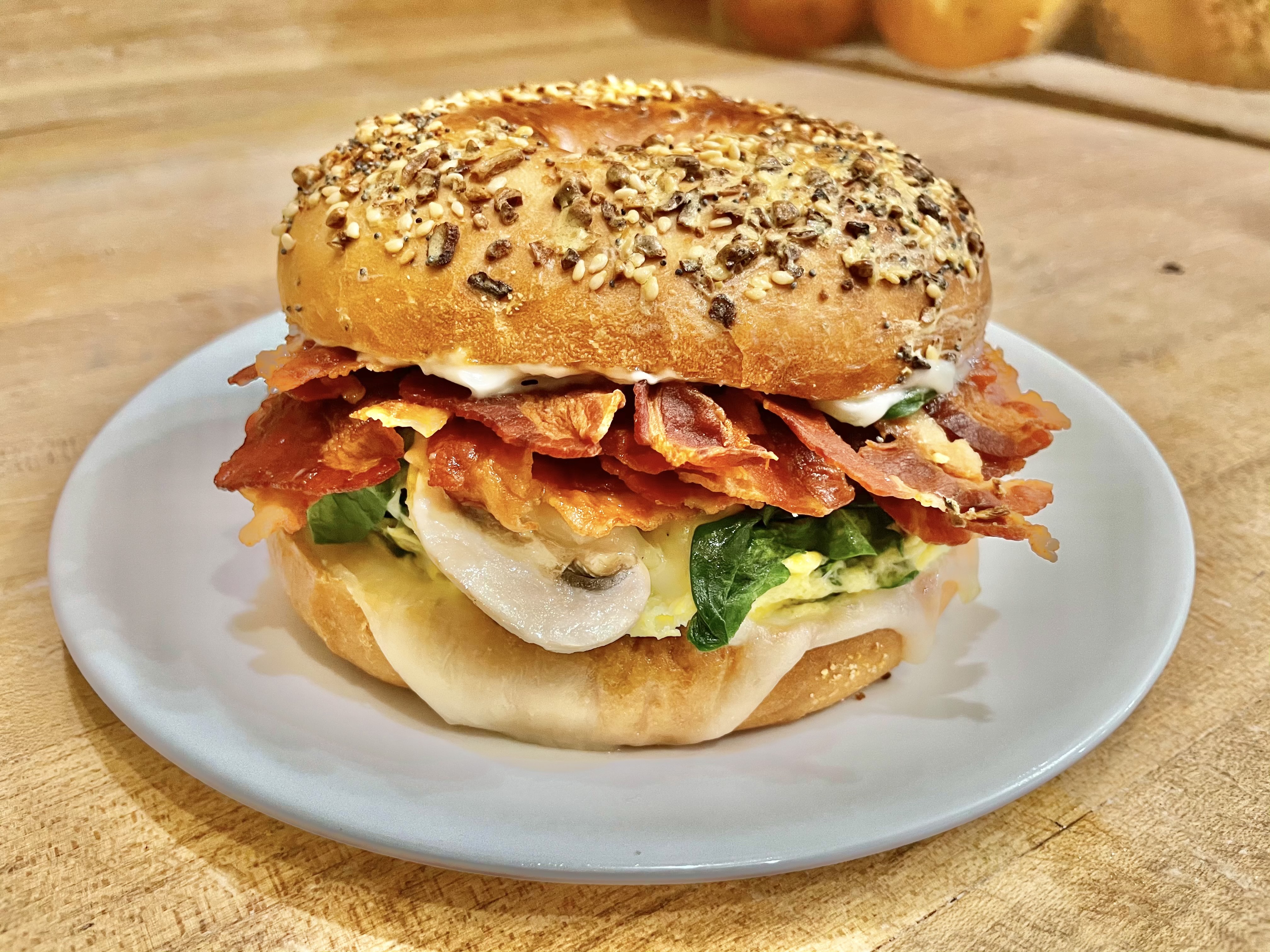 Order Bagel with Mayo, Egg, Mozzarella, Spinach, Mushroom and Bacon food online from Glaze Donuts And Bagel Sandwiches store, San Francisco on bringmethat.com
