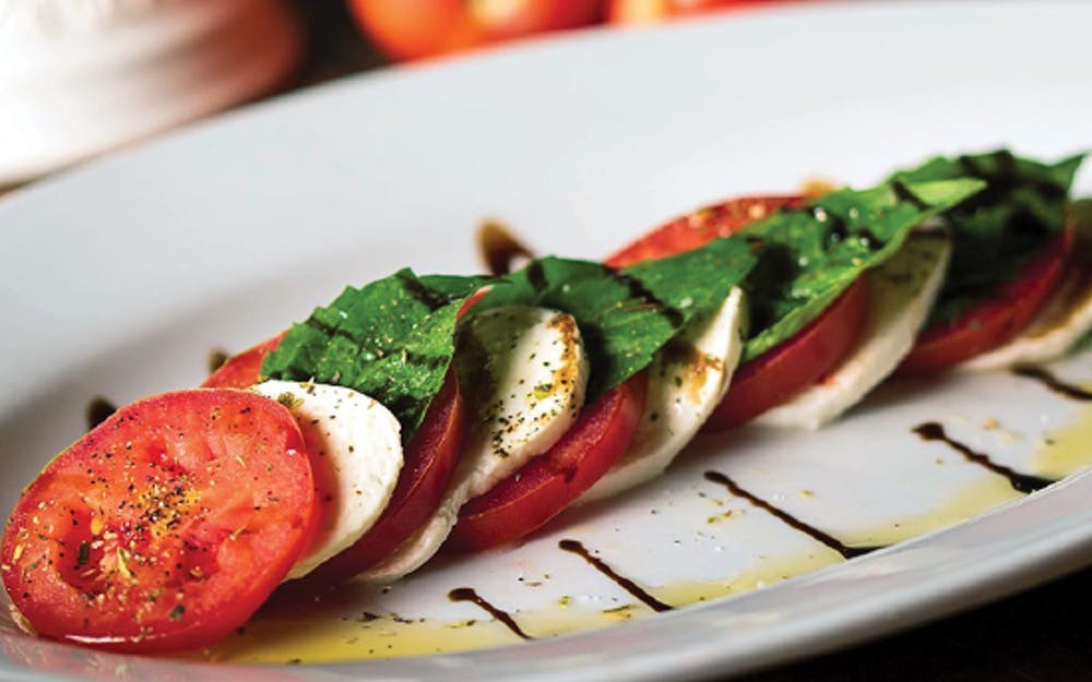 Order Caprese Salad - Large food online from Russo New York Pizzeria store, Houston on bringmethat.com