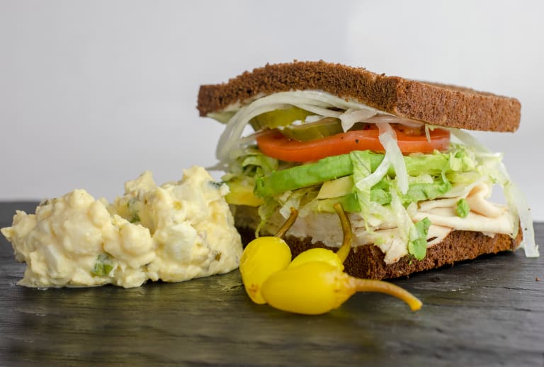 Order 1/2 Sandwiches On Squaw, Rye and Sourdough Bread with Salad food online from Butch store, Springfield on bringmethat.com