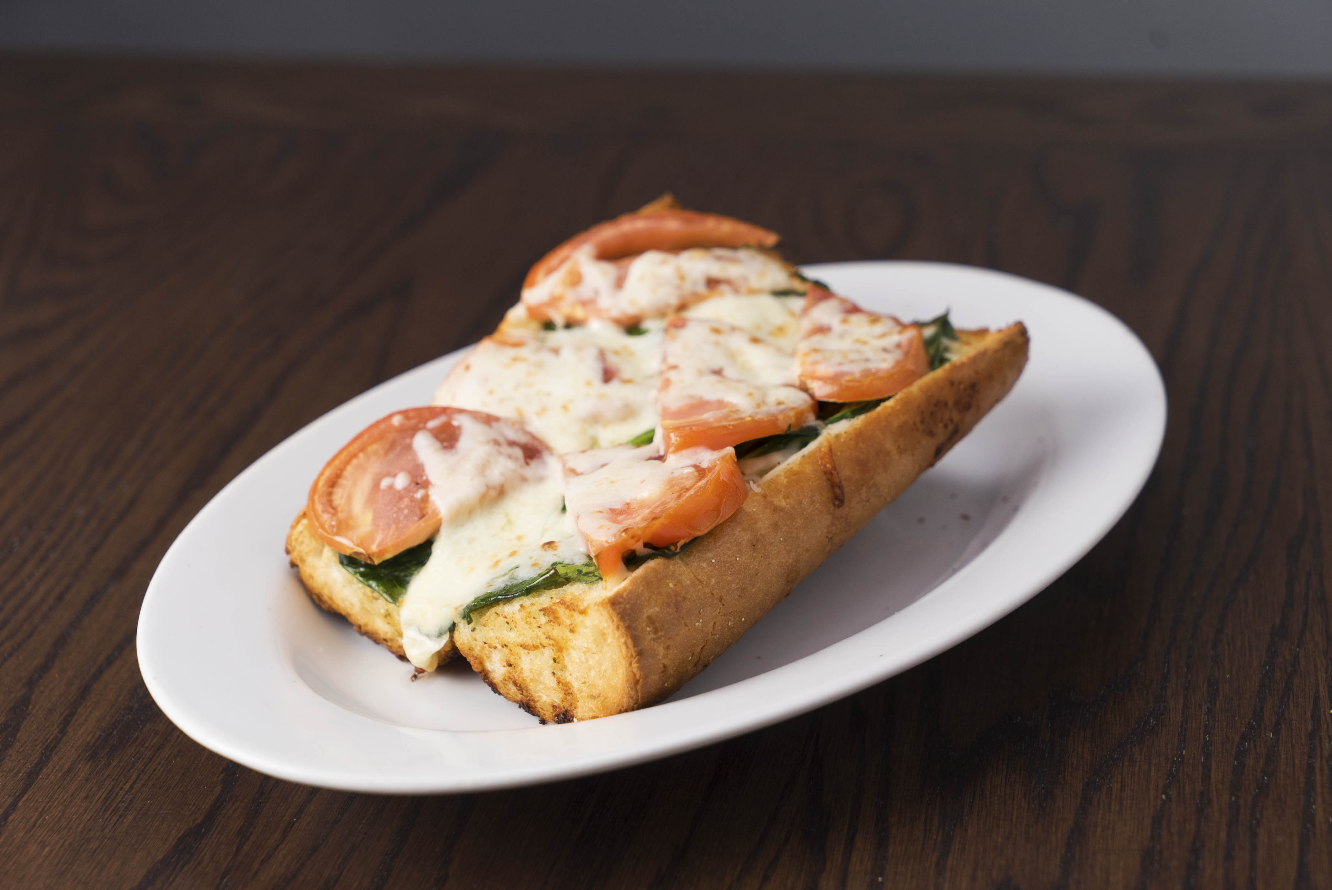 Order Garlic Bread with Spinach and Tomato food online from Rosati Pizzeria store, Pekin on bringmethat.com