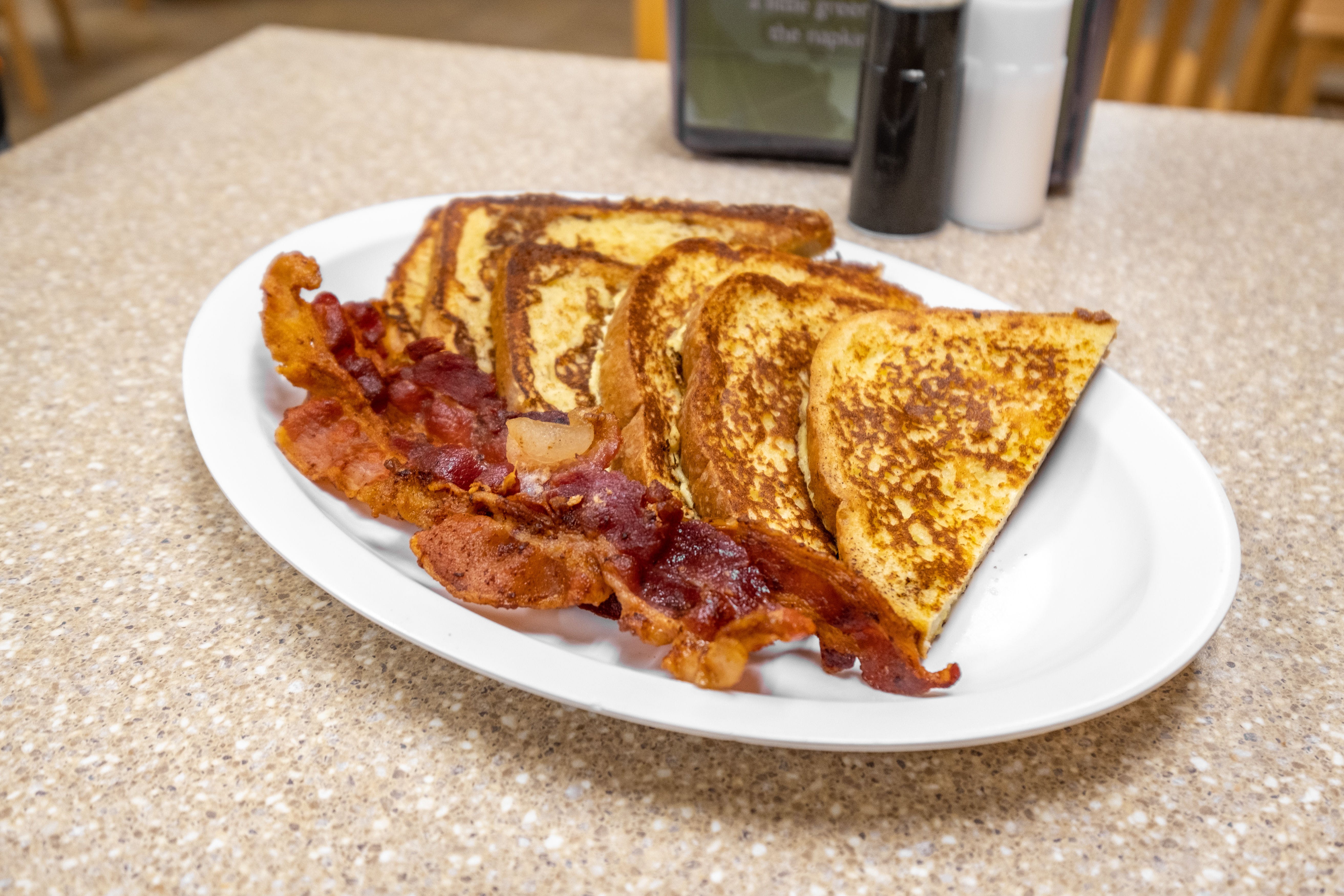 Order Three Slices of French Toast Breakfast - Toast food online from Roma Breakfast & Pizzeria store, Columbia on bringmethat.com