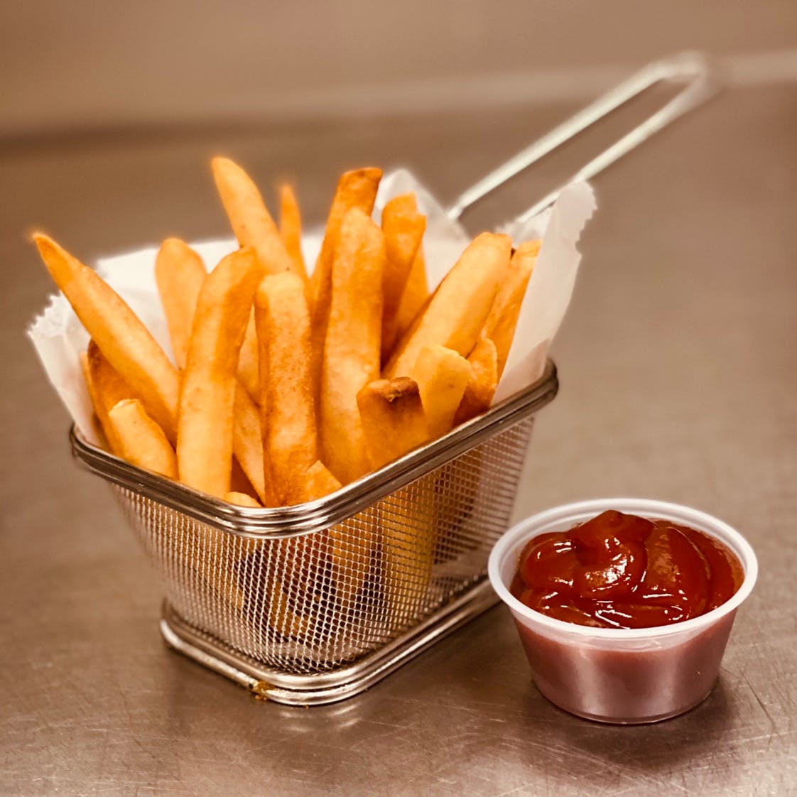 Order French Fries - Appetizer food online from Pino's on Main Pizza store, Rockford on bringmethat.com