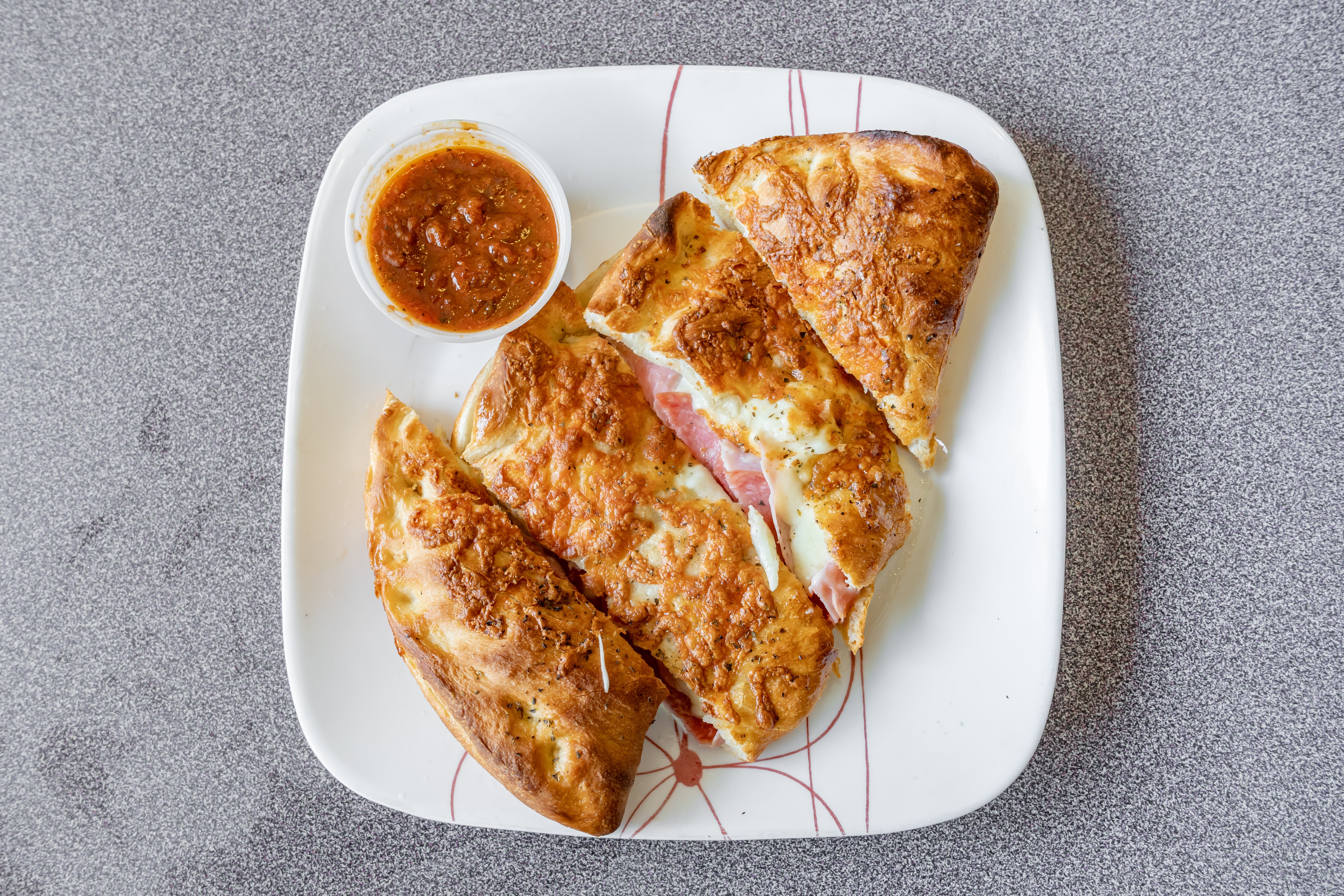 Order Calzone - Small food online from Arlington House of Pizza store, Arlington on bringmethat.com
