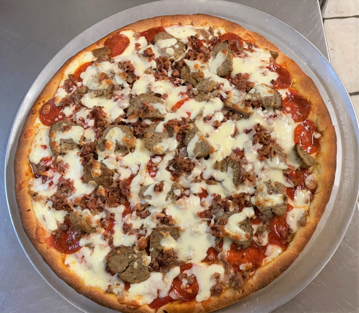 Order Meat Lovers food online from Pizza Town & Grill store, Bristol on bringmethat.com