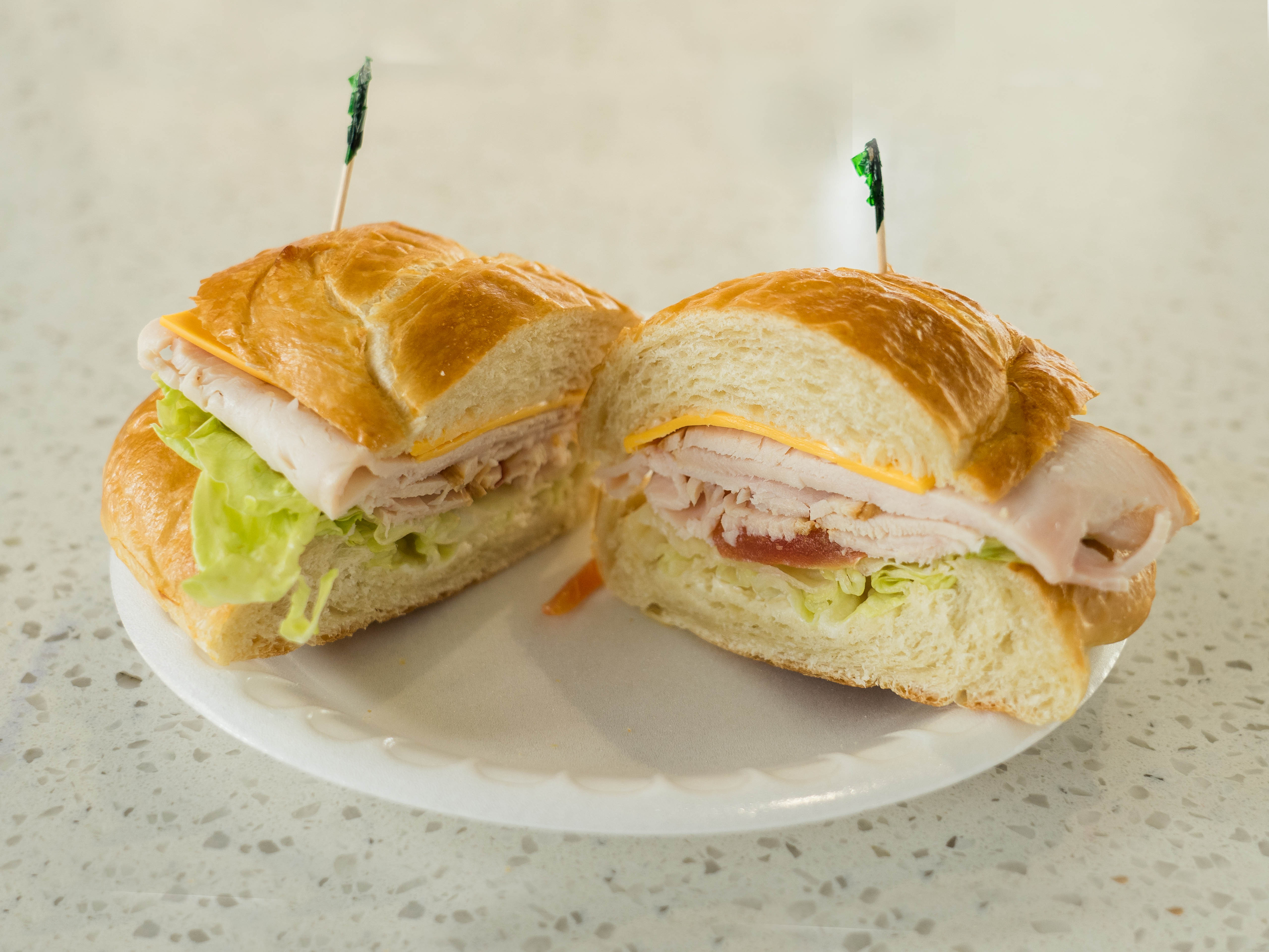 Order 32. Turkey Sandwich on Croissant food online from Lee Sandwiches store, Corona on bringmethat.com