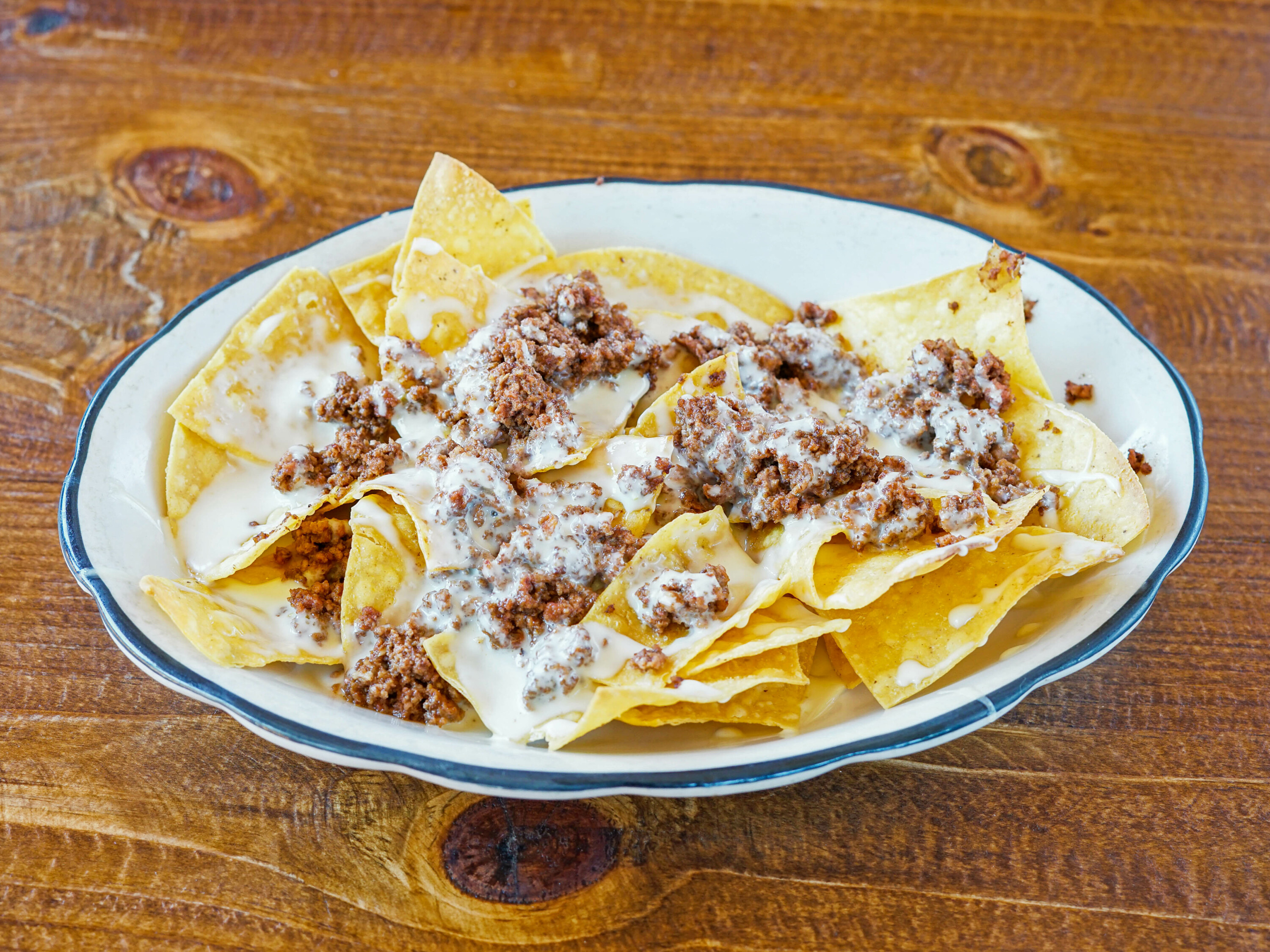 Order Nachos with Beef food online from Rey Azteca store, State College on bringmethat.com