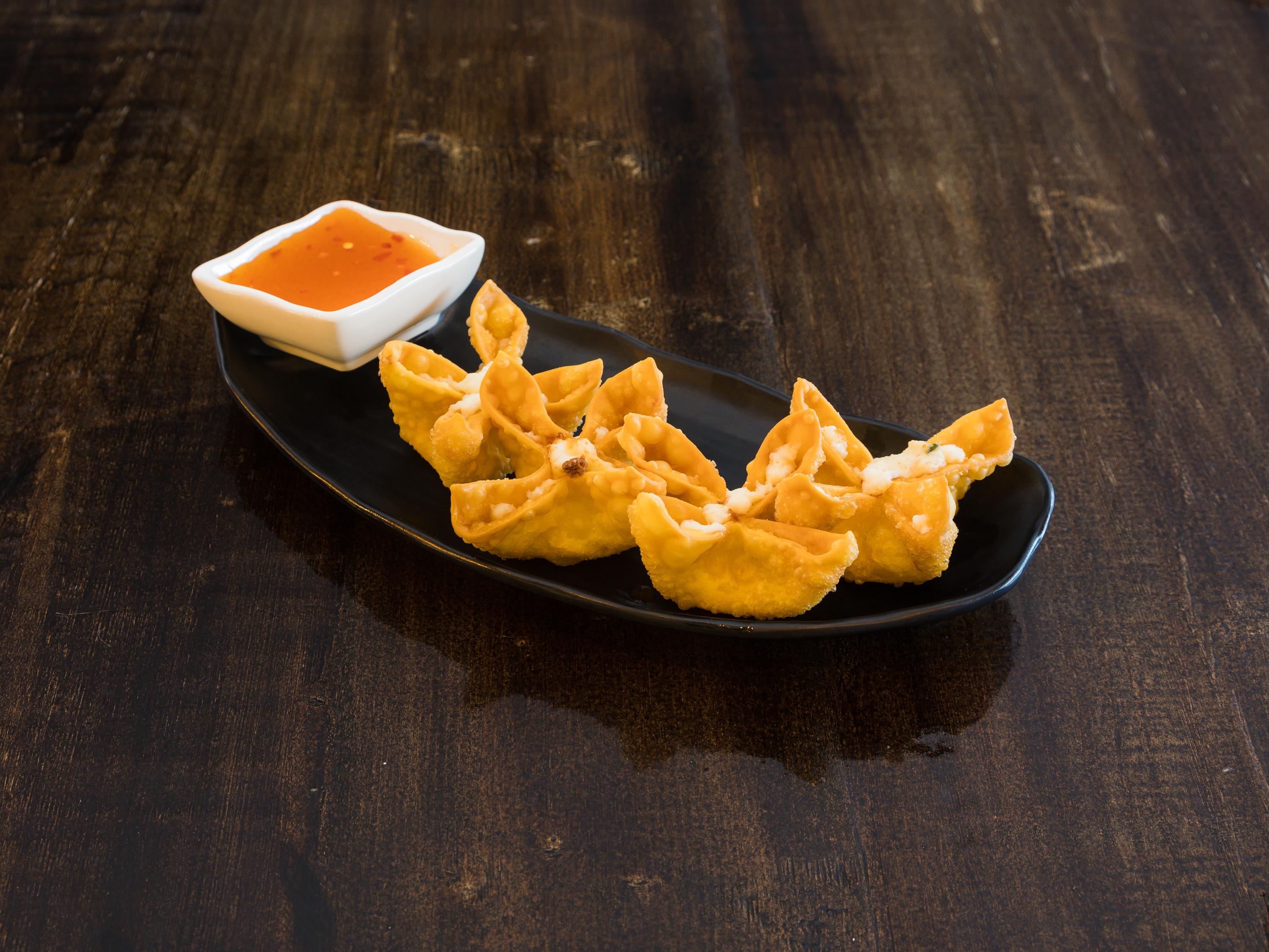 Order Crab Rangoons food online from Typhoon Noodle store, Asheville on bringmethat.com