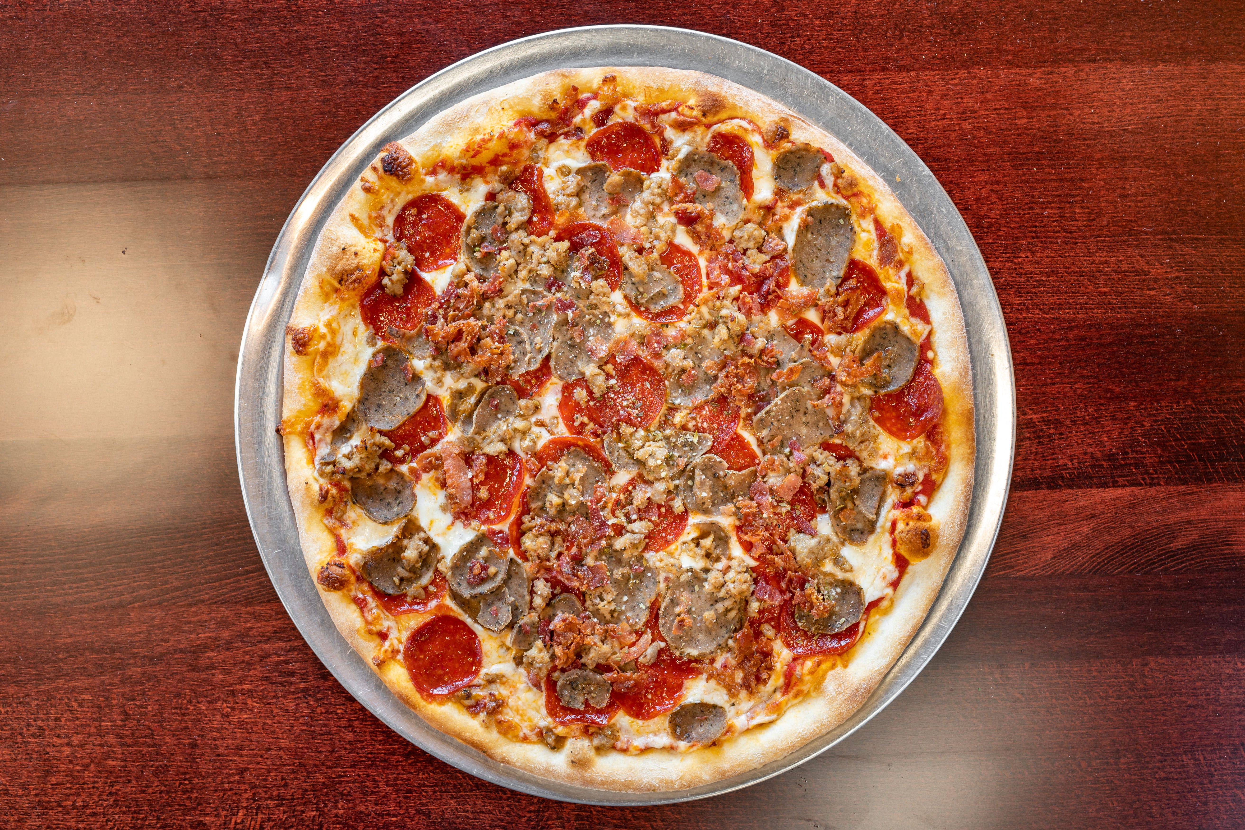 Order Meat Combo Pizza - Personal 10" food online from Capriccios Italian Restaurant store, Henrico on bringmethat.com