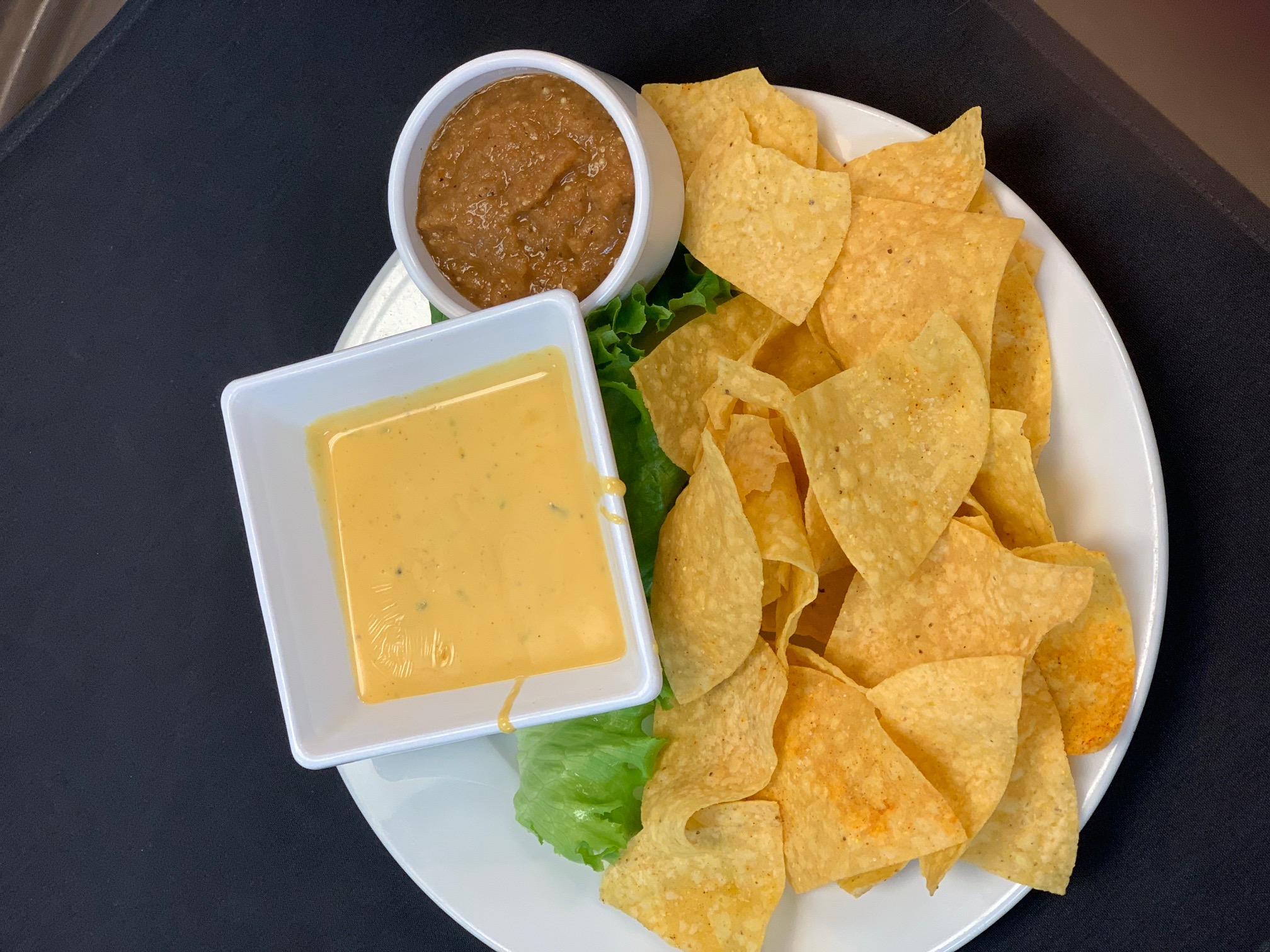 Order Chips and Queso food online from 2 Penguins Tap And Grill store, Centennial on bringmethat.com
