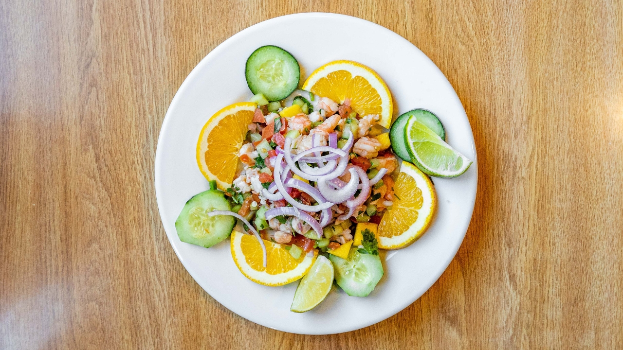 Order Tostada de Ceviche Tropical $9 food online from Los Cuates Buffet store, Gilroy on bringmethat.com