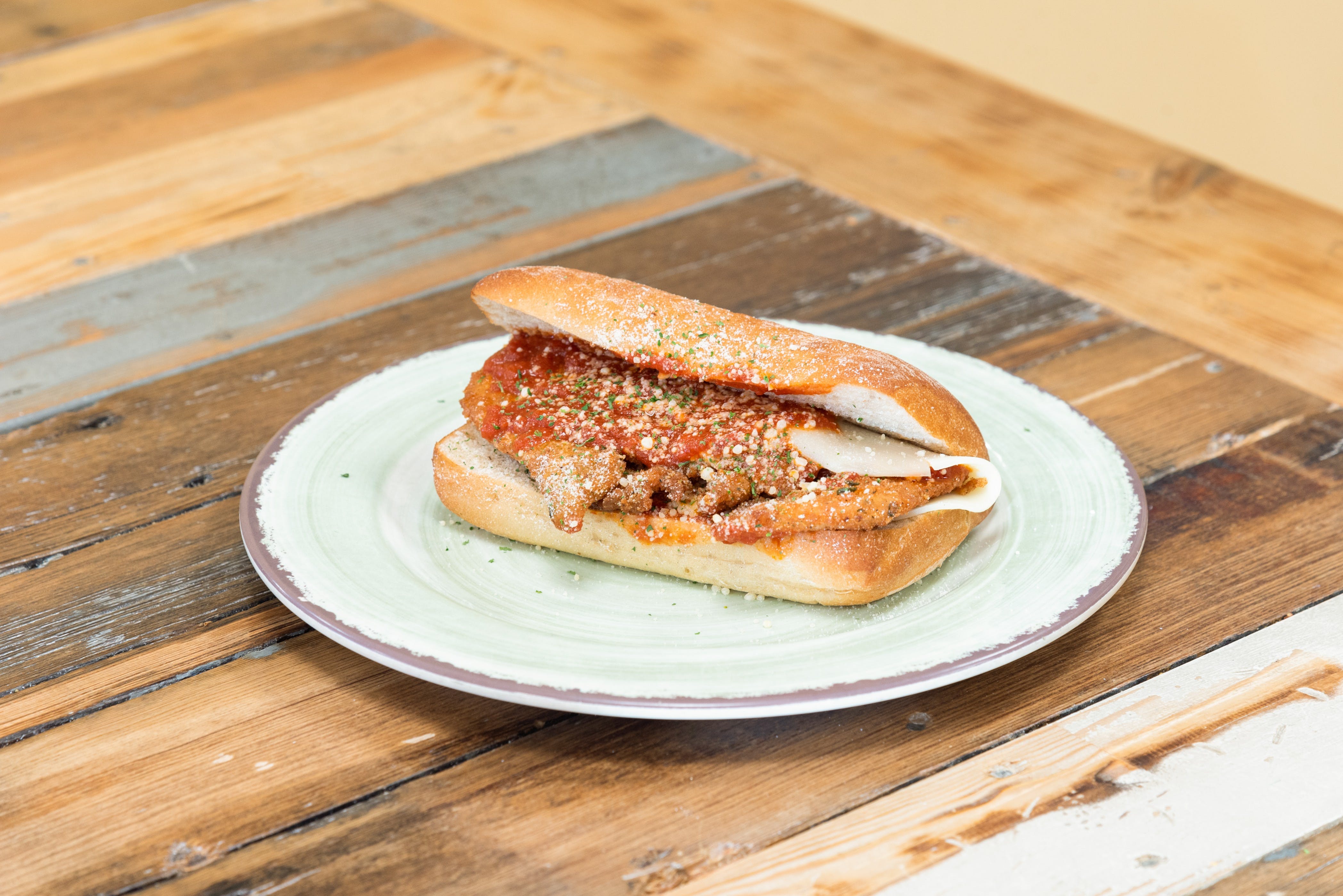 Order Chicken Cutlet Parmigiana Sub - Small food online from Milano's Delicatessen store, East Boston on bringmethat.com
