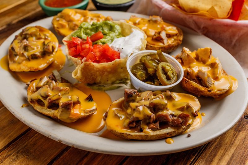 Order PAPA Nachos 1/2 Order food online from Cilantros Mexican Restaurant store, Houston on bringmethat.com
