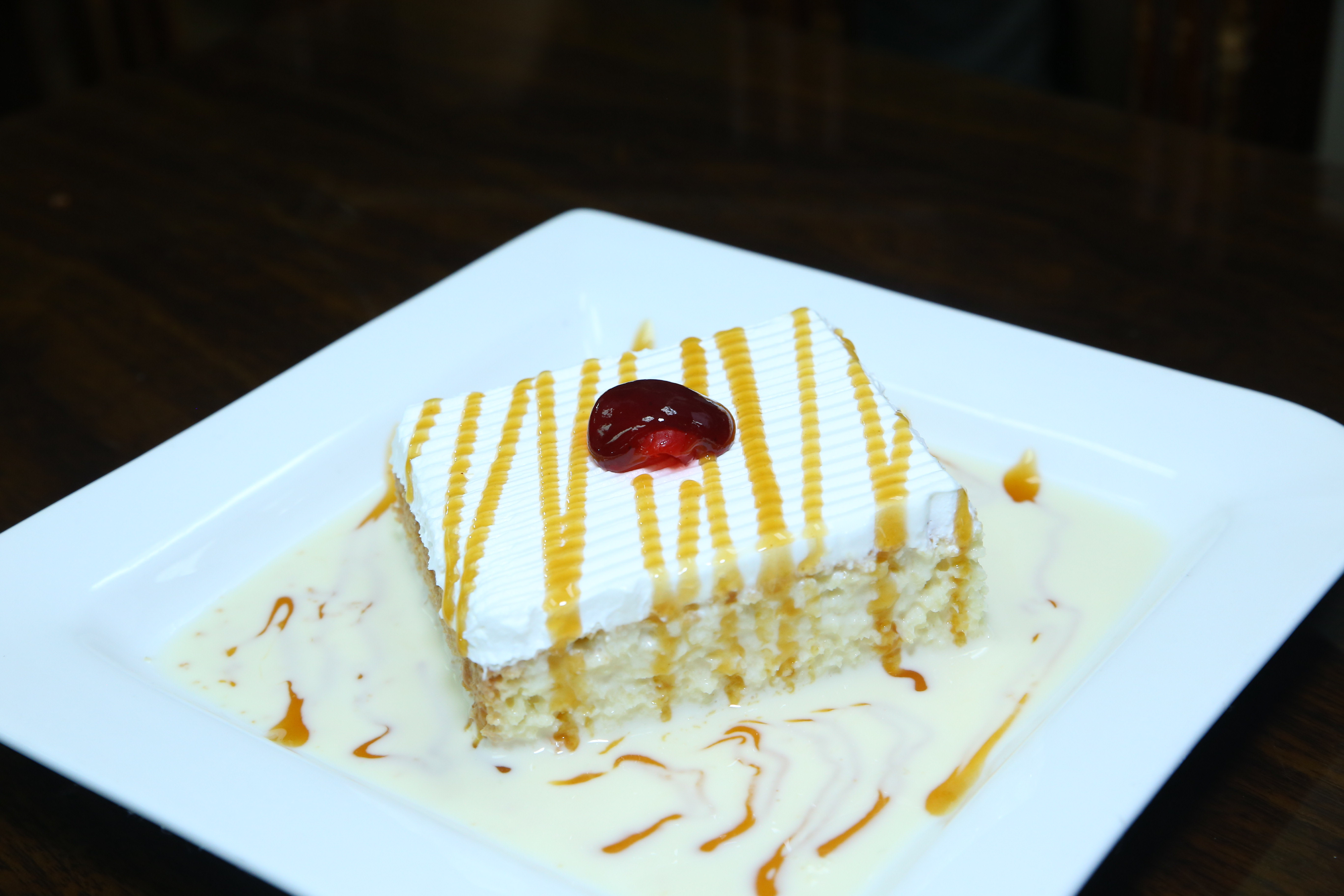 Order Tres Leches Cake food online from Caridad Restaurant store, Corona on bringmethat.com