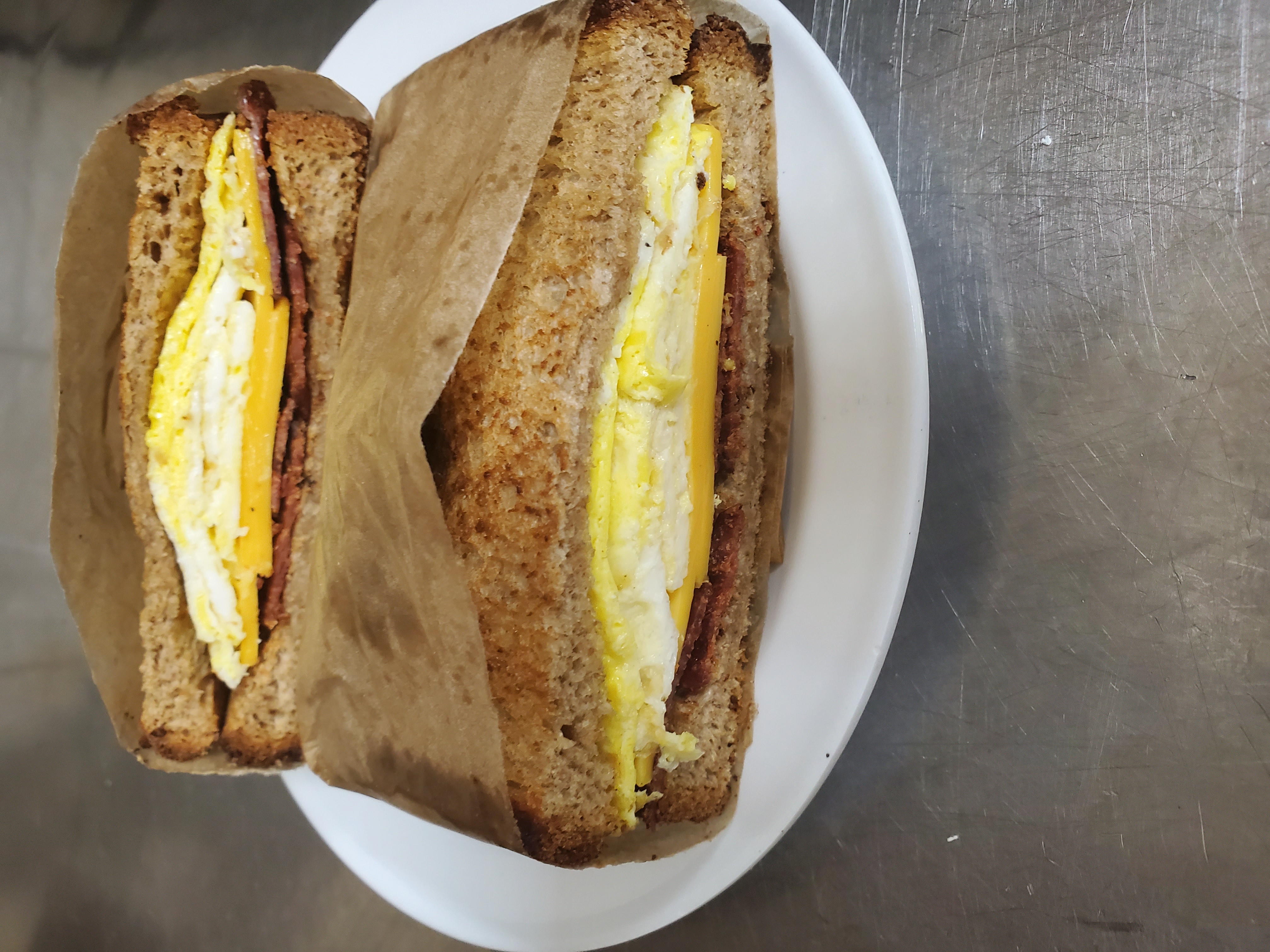Order Turkey bacon, egg & cheese  food online from Aminas Cafe store, Bronx on bringmethat.com