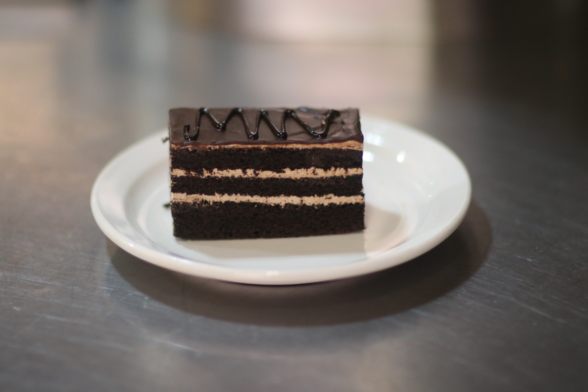 Order chocolate mousse cake slice food online from Tillie's Fine Food & Coffee Company store, Lodi on bringmethat.com