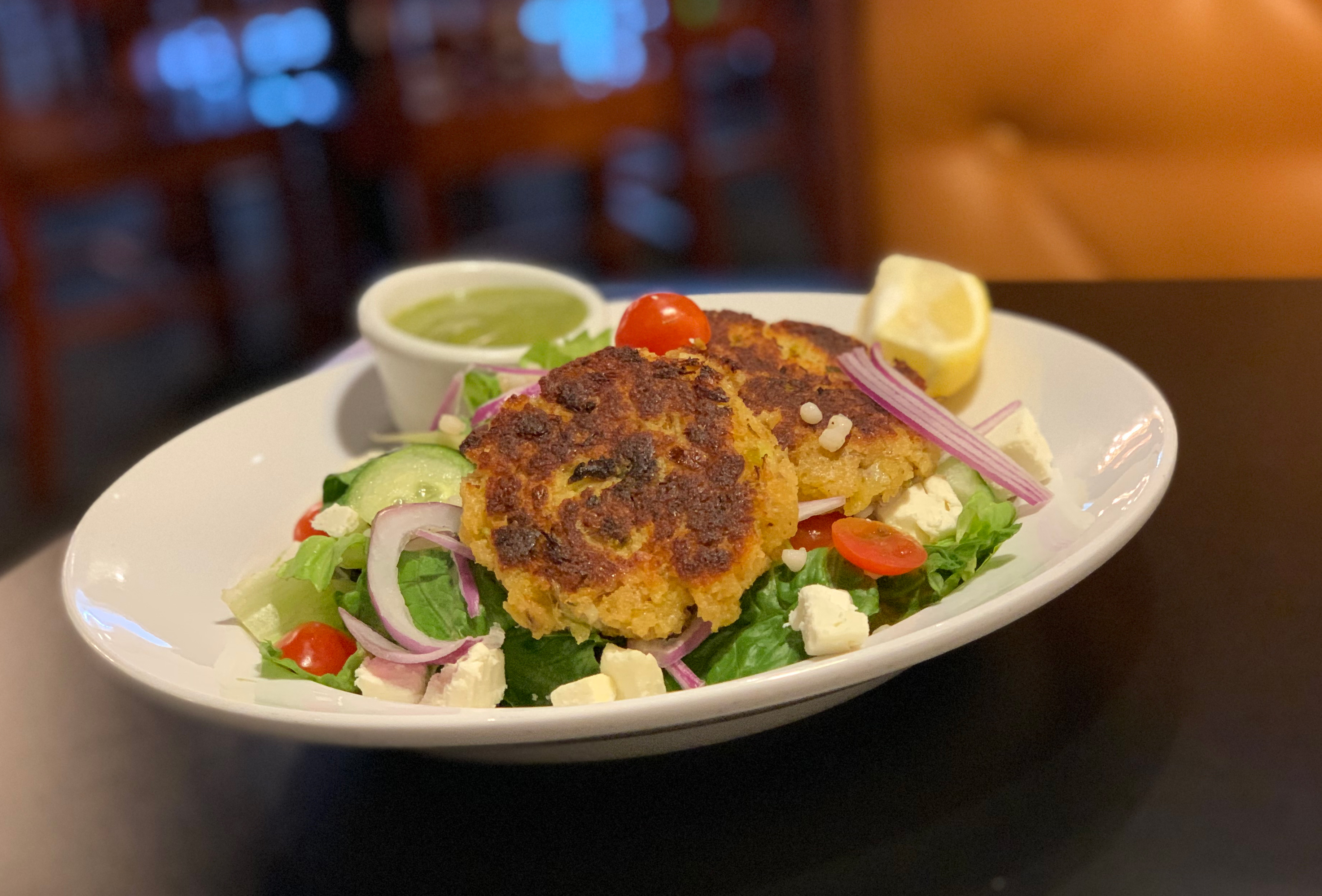 Order Crab Cake Salad food online from Taxi Grille & Bar store, Omaha on bringmethat.com
