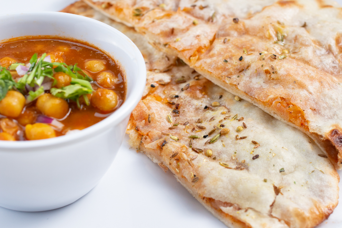 Order 19. Amritsari Kulcha with Chole food online from Tulsi Indian Eatery store, Los Angeles on bringmethat.com