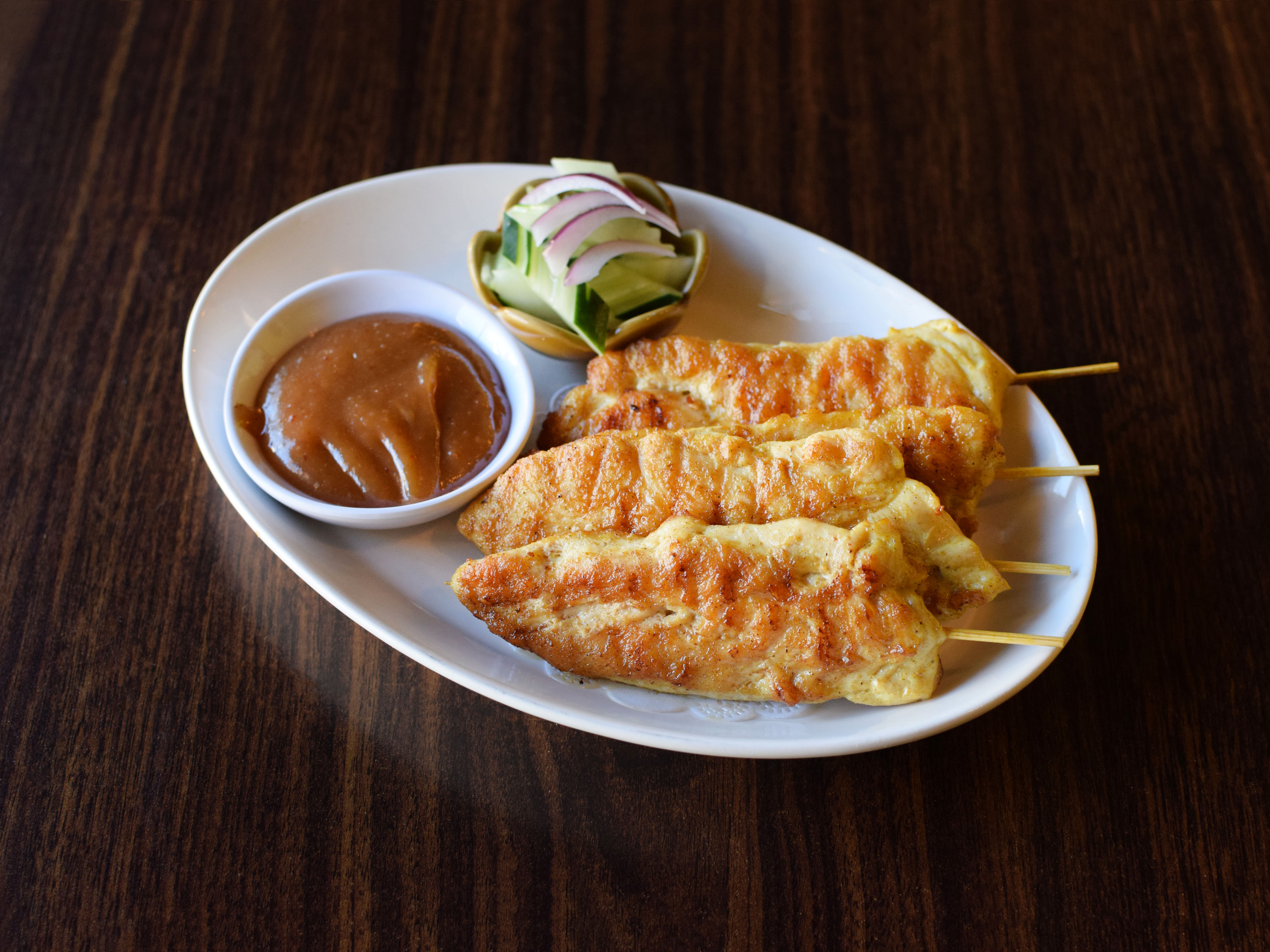 Order A7. Chicken Satay food online from Rice Thai Cafe store, Chicago on bringmethat.com