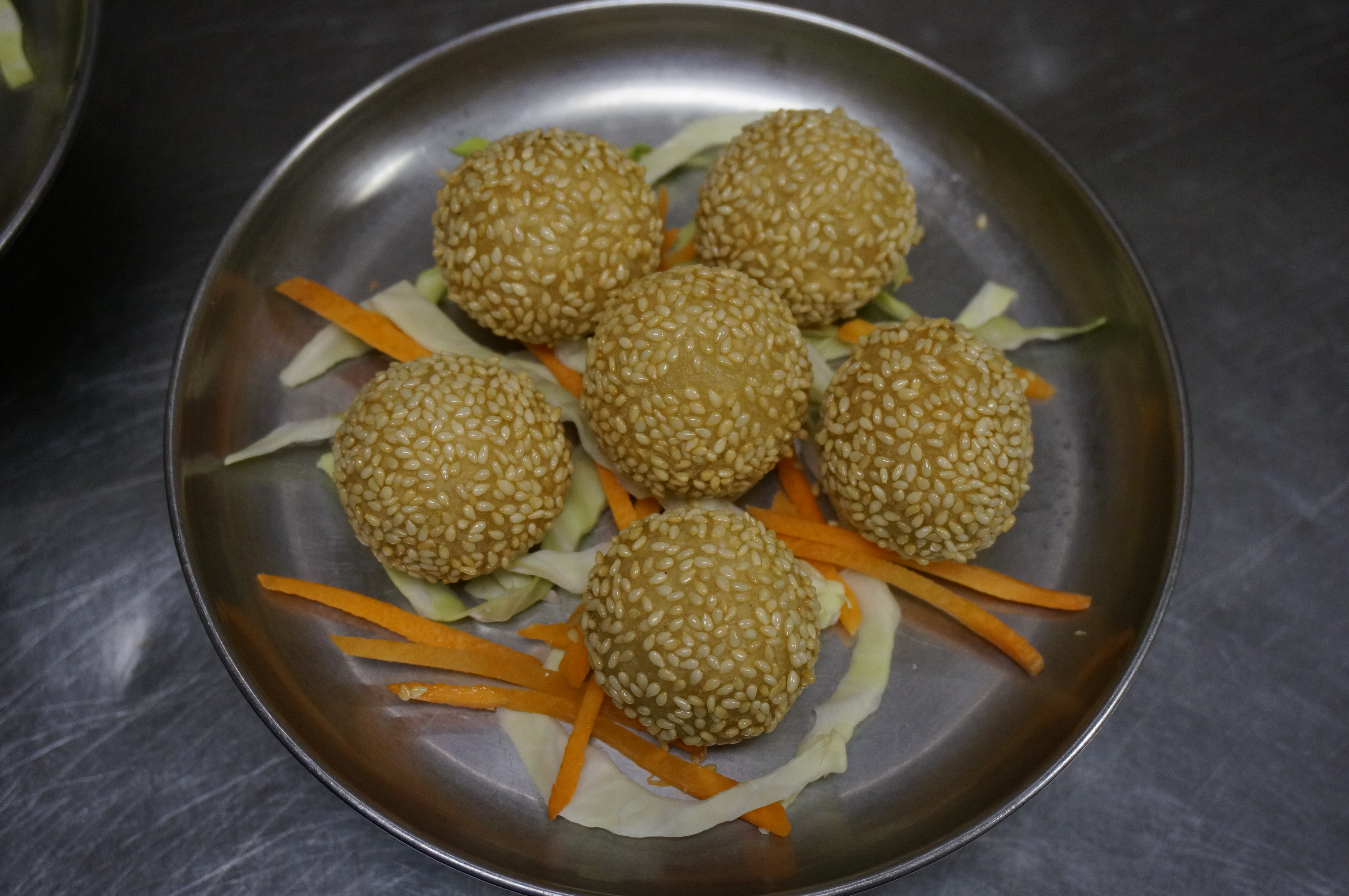 Order 13. Sesame Balls food online from Mayflower Chinese store, Capitola on bringmethat.com