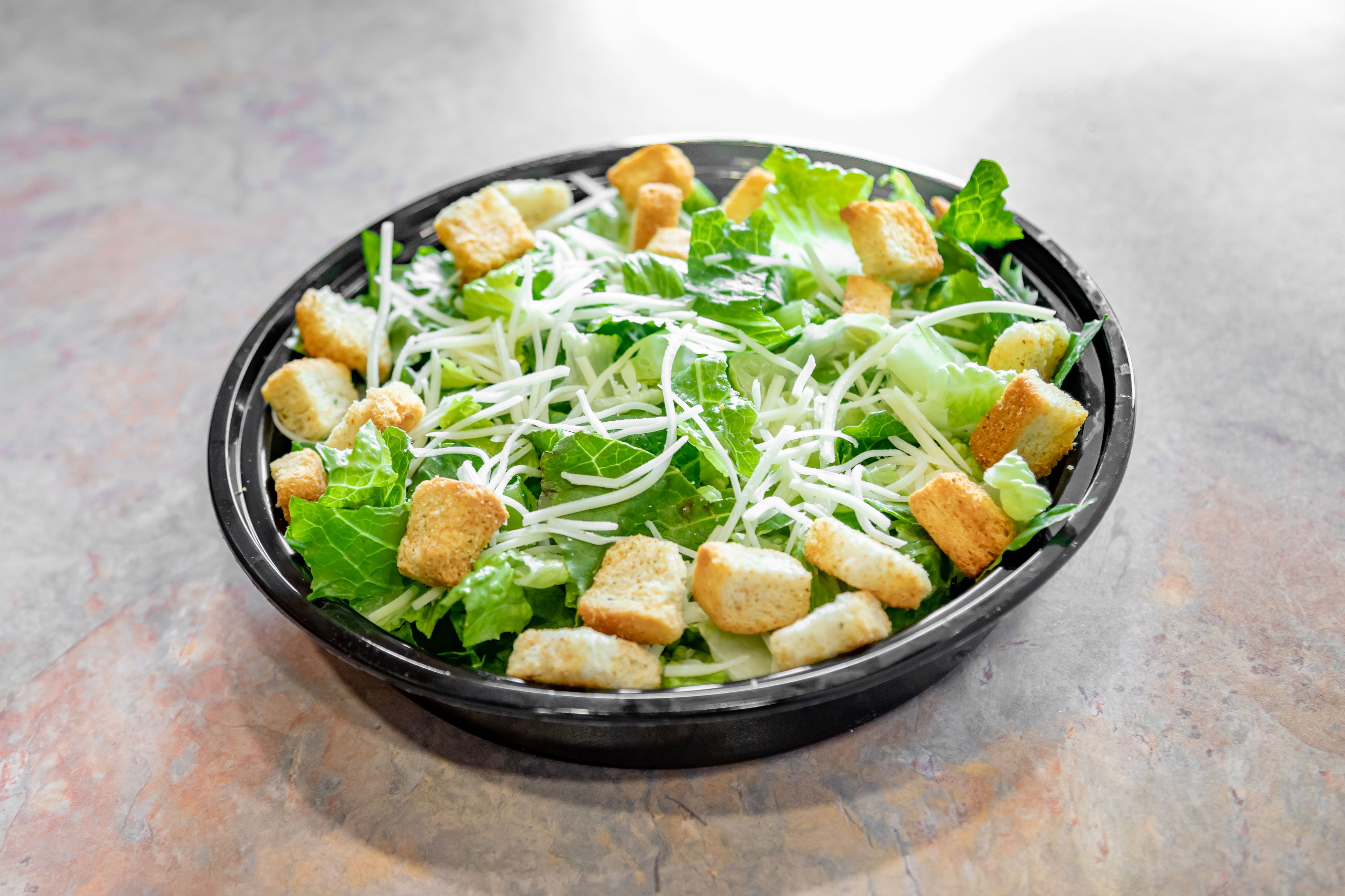 Order Caesar Salad - Caesar Salad food online from Bruno's Pizza store, Springfield on bringmethat.com