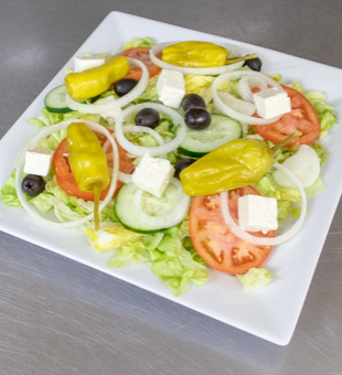 Order Greek Salad food online from Zayna's Pizza store, Milwaukee on bringmethat.com