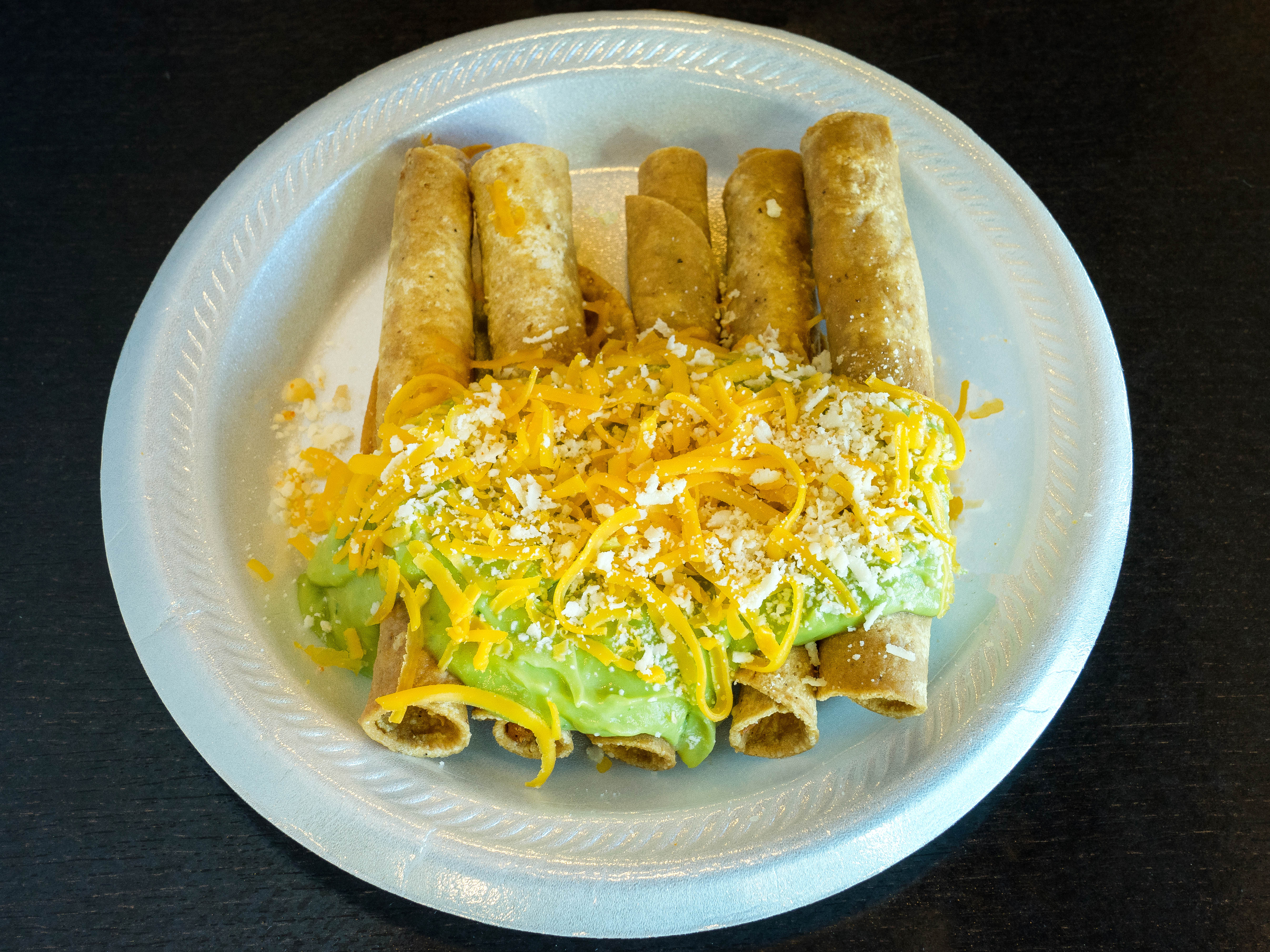 Order 5 Rolled Tacos with Cheese, Guacamole and Queso food online from Ronaldos Taco Shop store, Mission Viejo on bringmethat.com