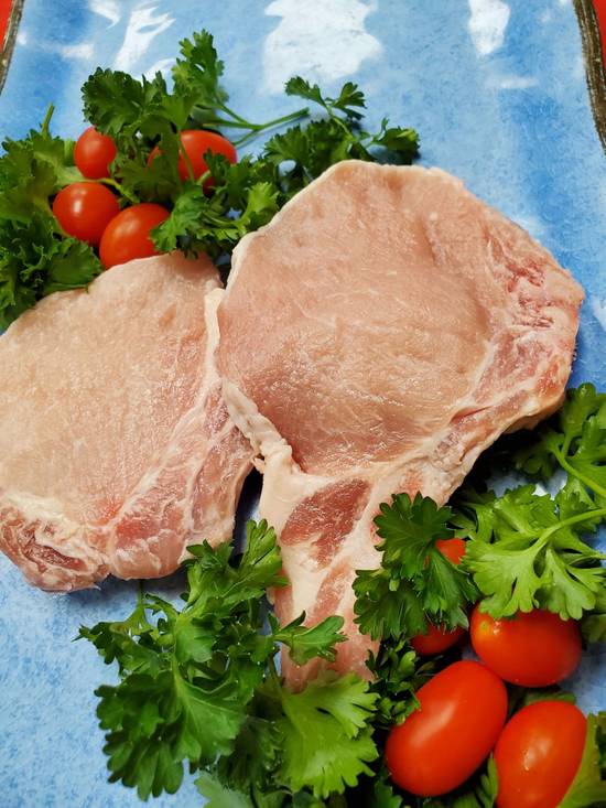 Order Bone-In Pork Chops (1 pc) food online from Cow Palace Butcher Shop store, Middle Island on bringmethat.com