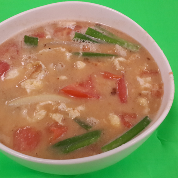 Order 25. Tomato Egg Drop Soup Chinese Style food online from May Loong Kitchen store, Syosset on bringmethat.com