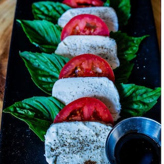 Order Caprese food online from Panini Pizza & Italian Kitchen store, West Hollywood on bringmethat.com