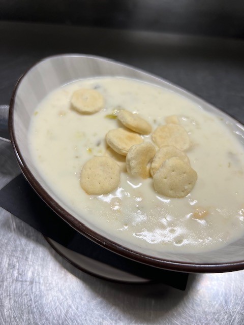 Order Creamy New England Clam Chowder food online from Bonfire Grille store, Milford on bringmethat.com