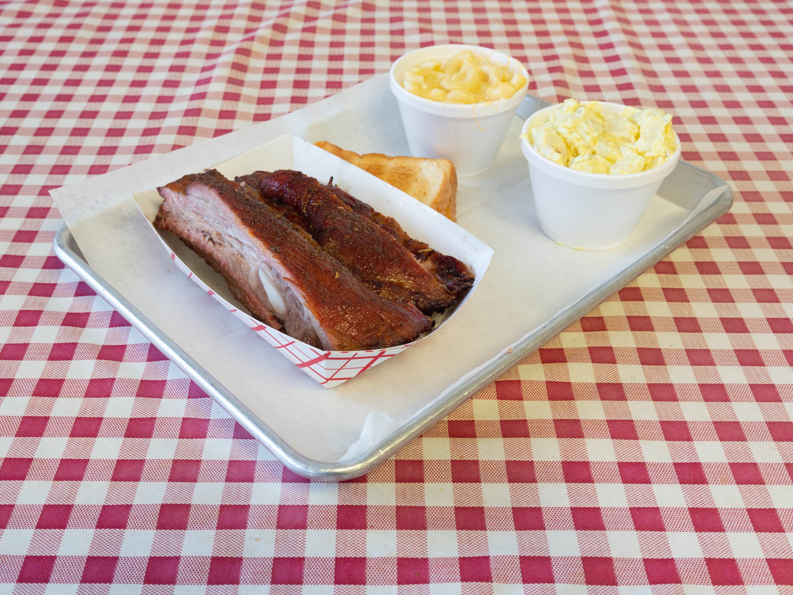 Order Rib Plate food online from Reggie's BBQ store, Clarksville on bringmethat.com