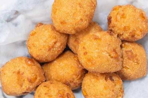 Order Hush Puppies (10 pcs) food online from Tasty Crab House store, Aiken on bringmethat.com