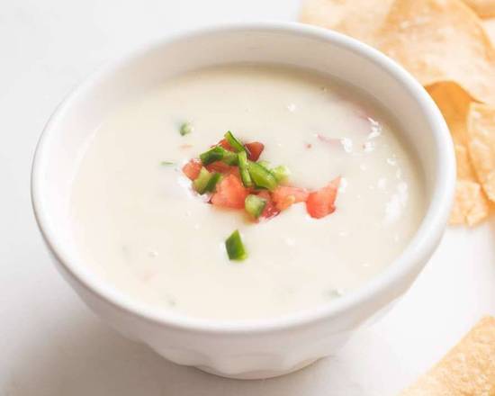 Order Queso Dip (6 oz) food online from Los Tres Amigos Mexican Restaurant store, Slidell on bringmethat.com