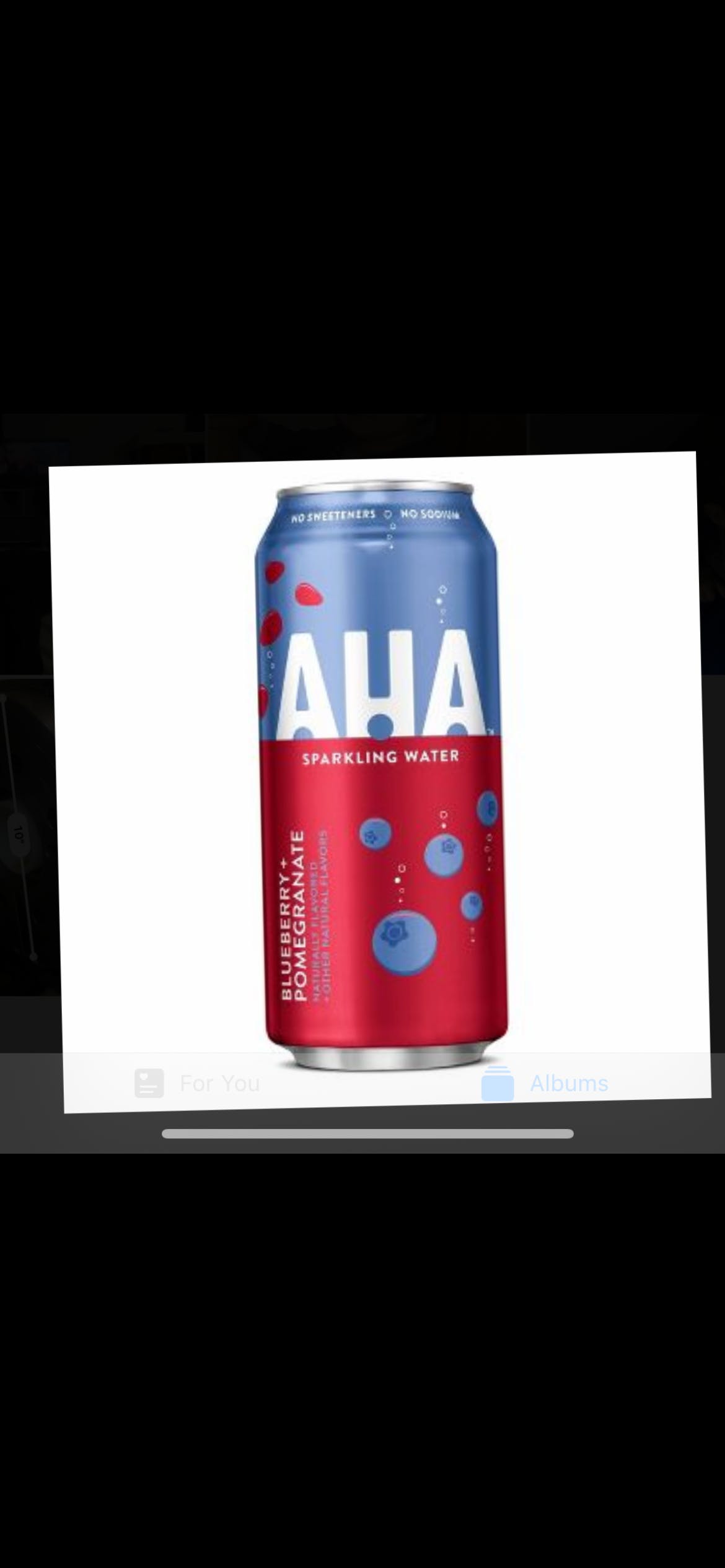 Order AHA Blueberry + Pomegranate Sparkling Water - AHA 16 fl oz Can food online from Anthony Restaurant store, Torrington on bringmethat.com