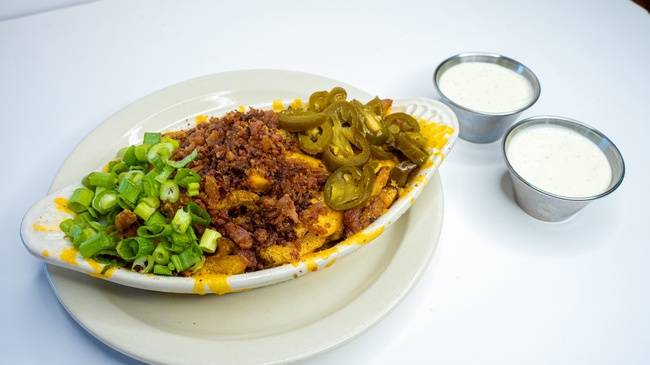 Order Cheddar Fries - Medium food online from Snuffer's store, Mesquite on bringmethat.com