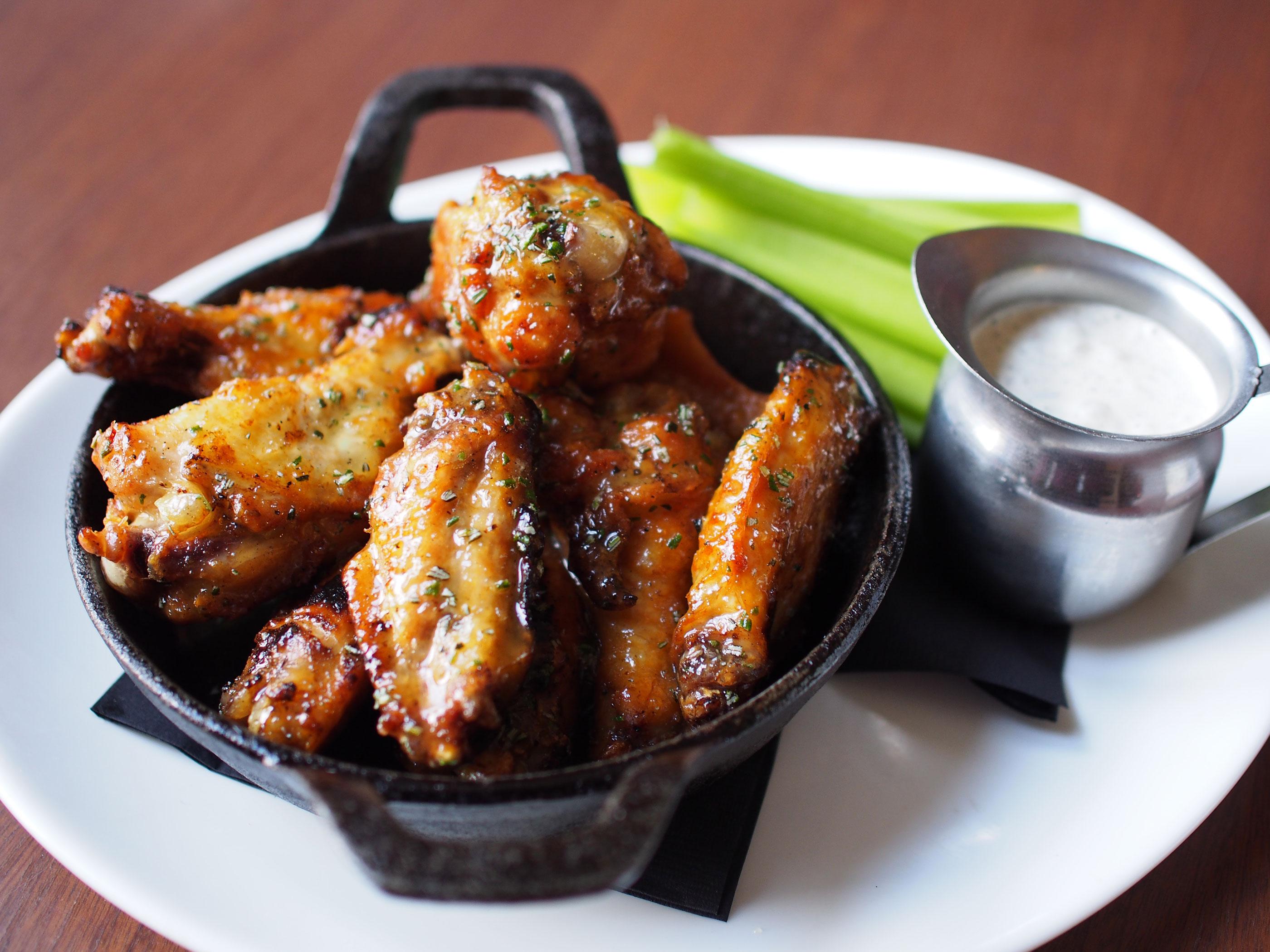 Order Buttered Old Bay Charred Wings (9) Fried Crispy with Celery and Ranch or Blue Cheese food online from Decades store, Lancaster on bringmethat.com