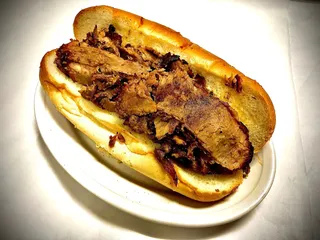 Order Barbeque Beef Brisket Sandwich food online from Lucky Chicago Style Grill store, Round Rock on bringmethat.com