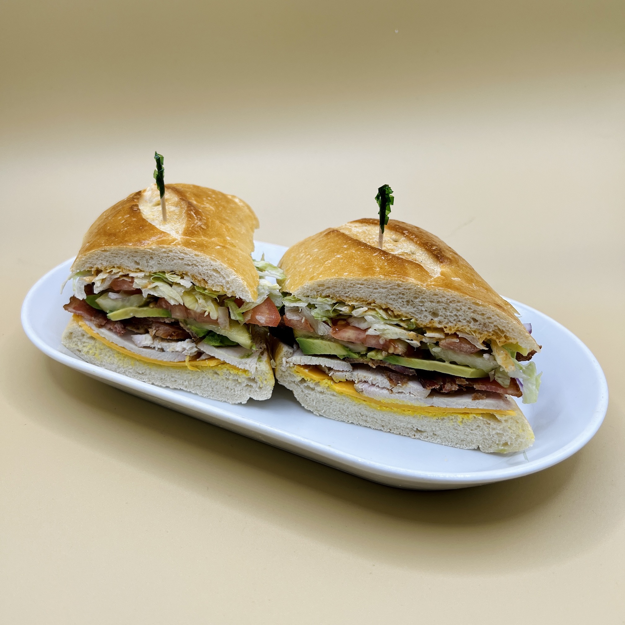 Order 13. Club Sandwich (Turkey, Grilled Chicken, or Chipotle Chicken) food online from Spreadz store, San Jose on bringmethat.com