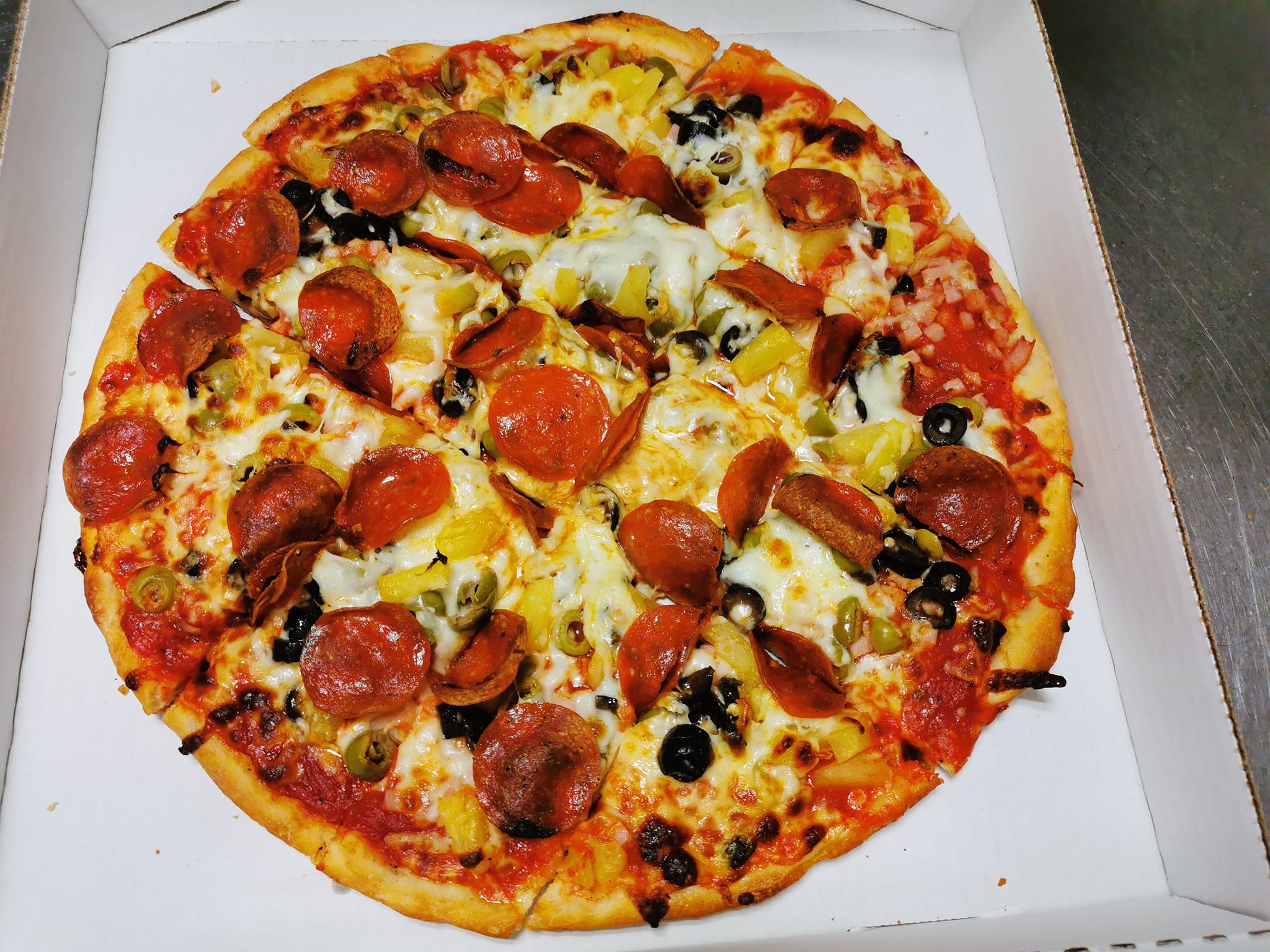 Order Four Toppings Pizza - Small 12'' food online from Angelos Restaurant & Pizza store, Spring Valley on bringmethat.com