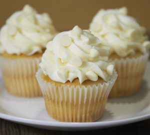 Order White Chocolate Cupcake food online from Cornerstone Cookie Gifts store, Marietta on bringmethat.com