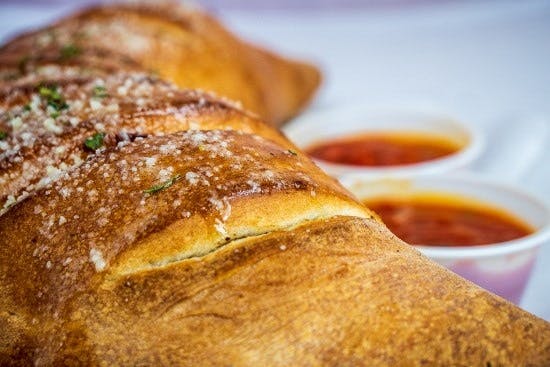 Order Spinach & Artichoke Calzone - Calzone food online from Pizza Pie Me store, Arlington on bringmethat.com
