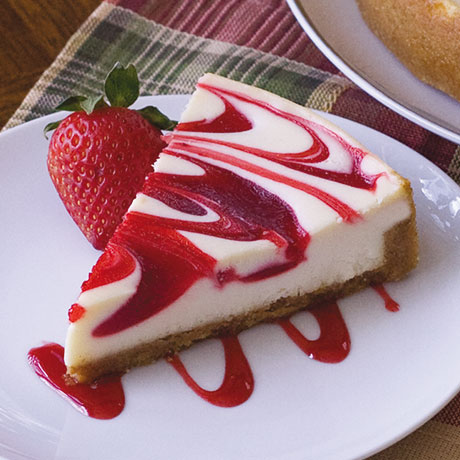 Order Strawberry Swirl Cheesecake food online from Haunted House Restaurant store, Omaha on bringmethat.com