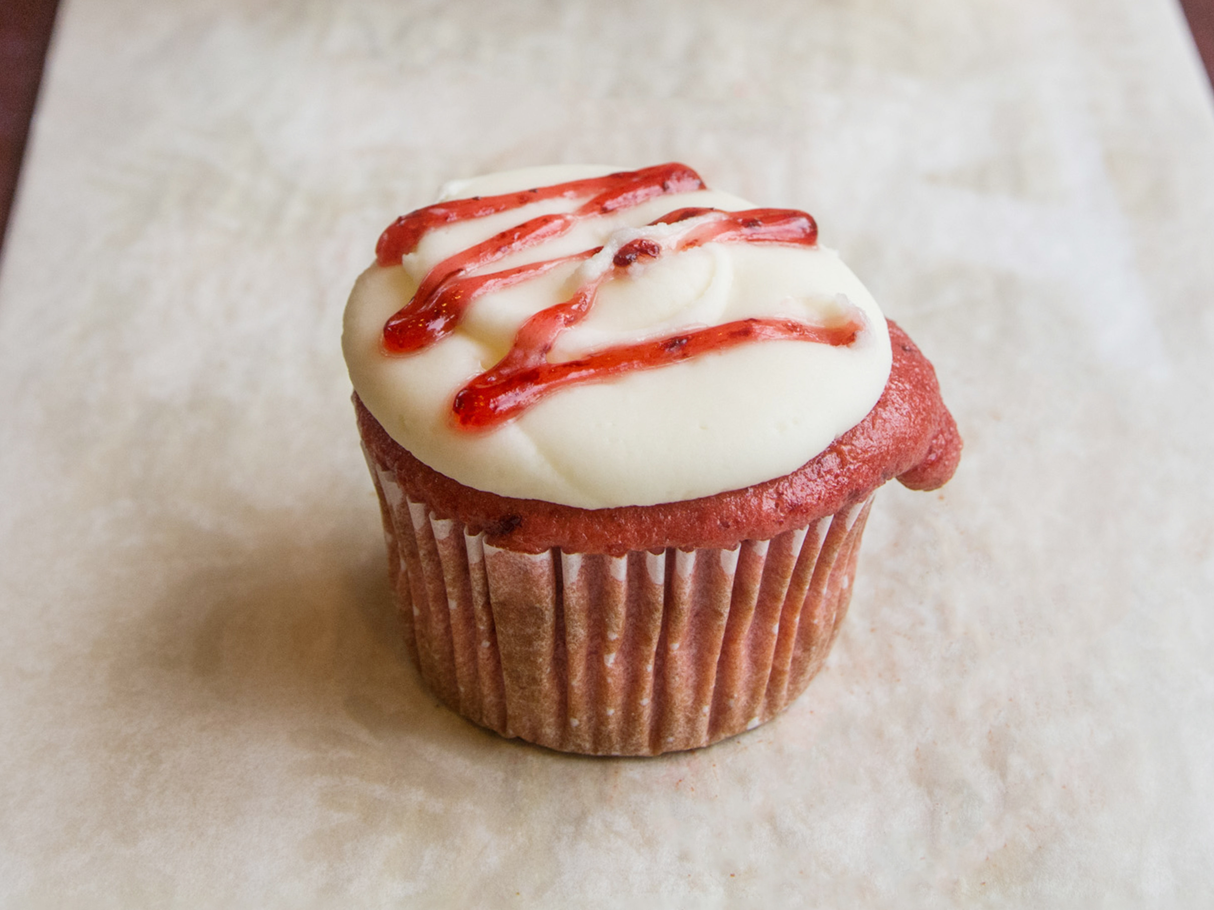 Order Strawberry and Cream Cheese Butter Cream Cupcake food online from Oh, What A Cake! store, Columbia on bringmethat.com