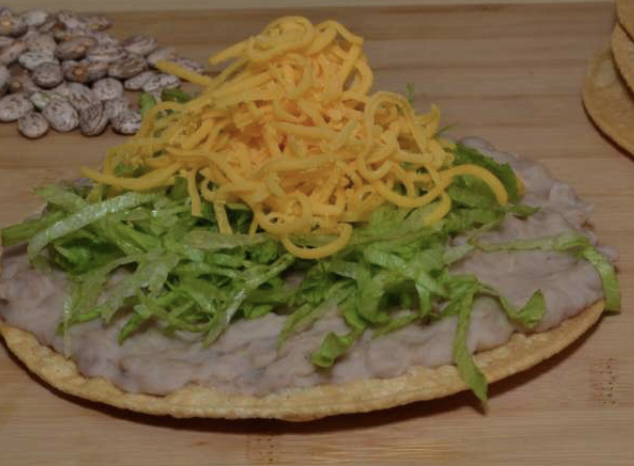 Order Bean Tostada food online from Federico Mexican Food store, Albuquerque on bringmethat.com